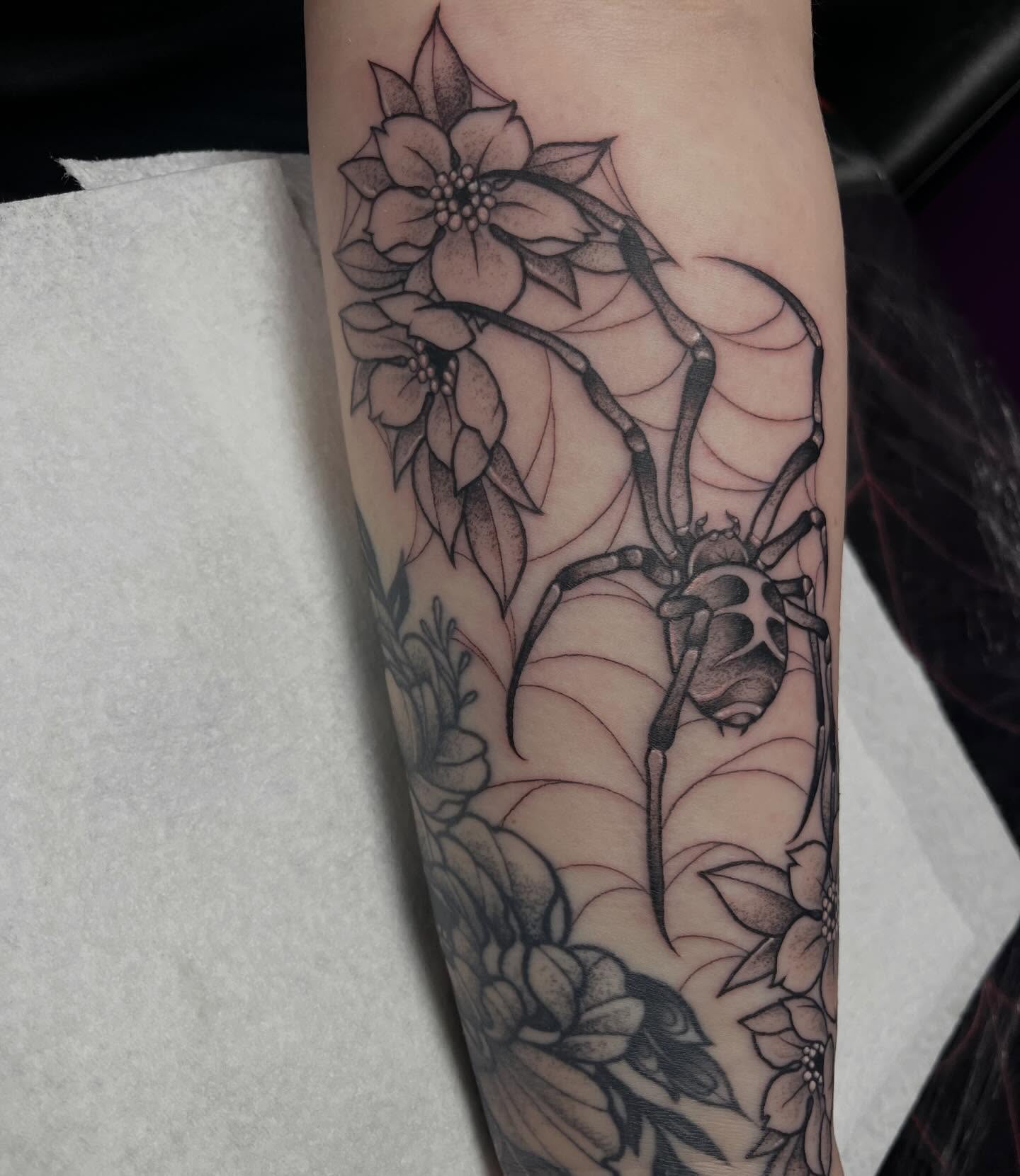 Spider and flowers realism tattoo on the forearm by Olivia Whan Tattoos🌙