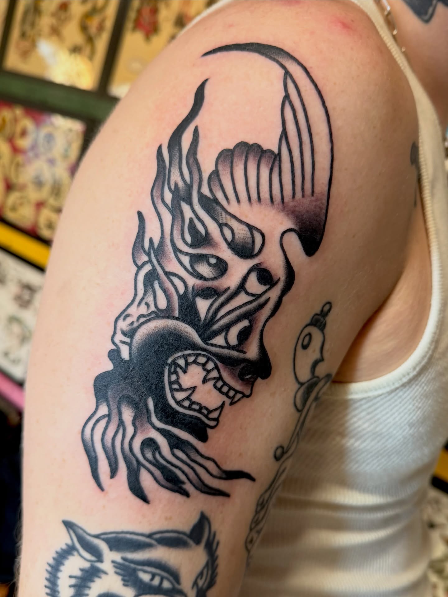 Demon head black and grey tattoo on the shoulder by Steven