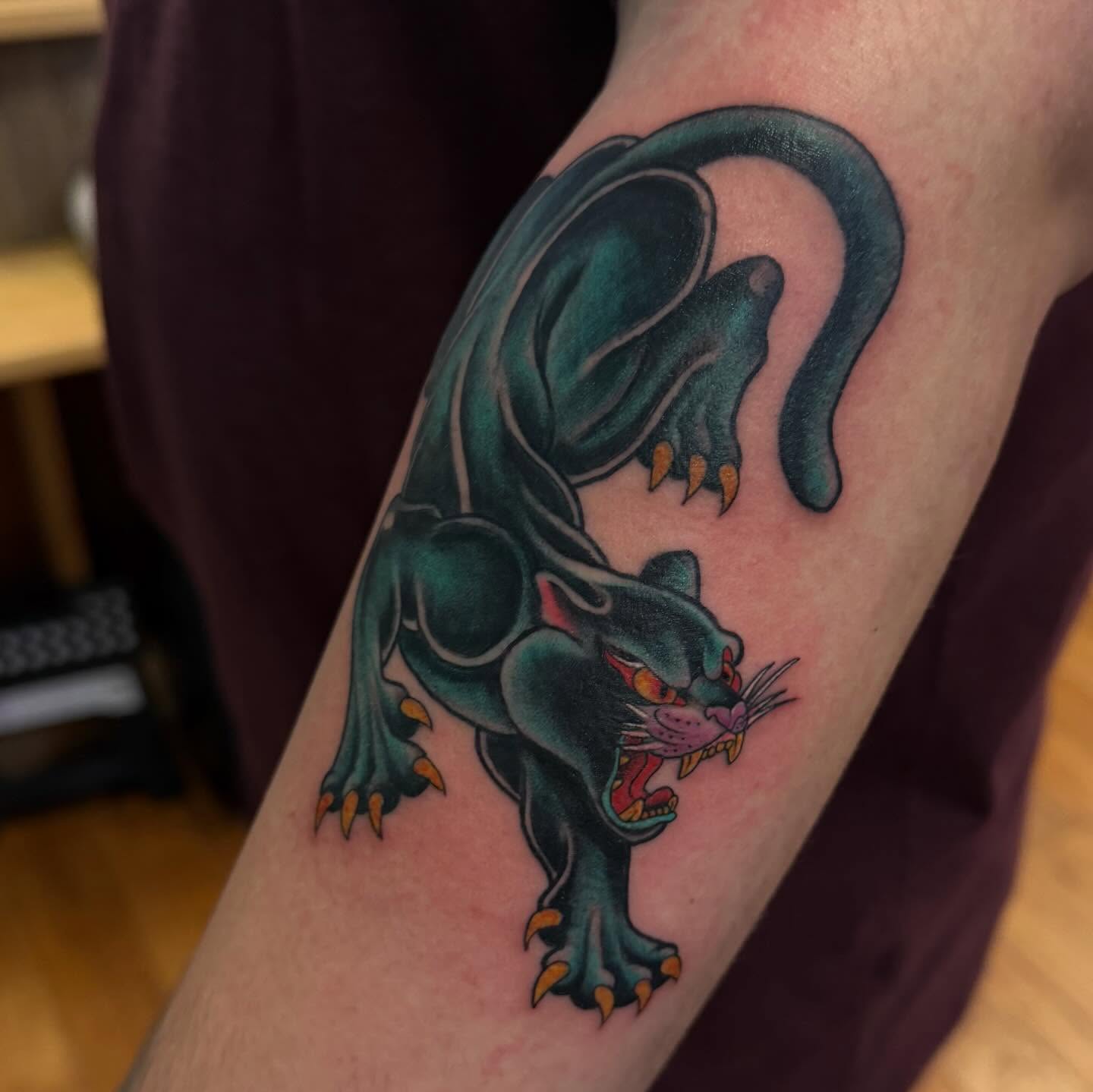 Panther American traditional tattoo on the forearm by Madilynn Klassen