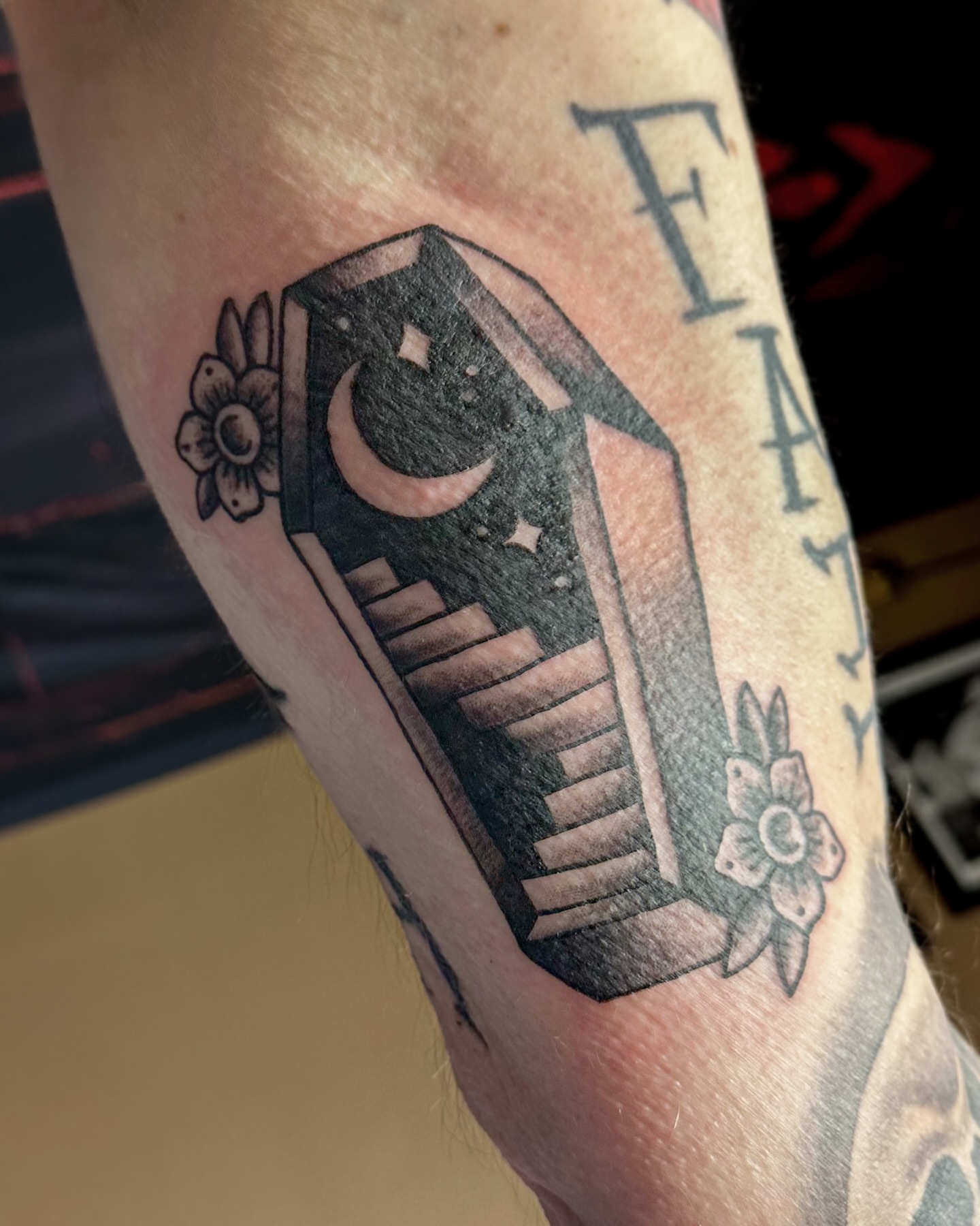 Coffin with crescent moon American traditional tattoo on the forearm by π·πππ, Cleveland, Ohio