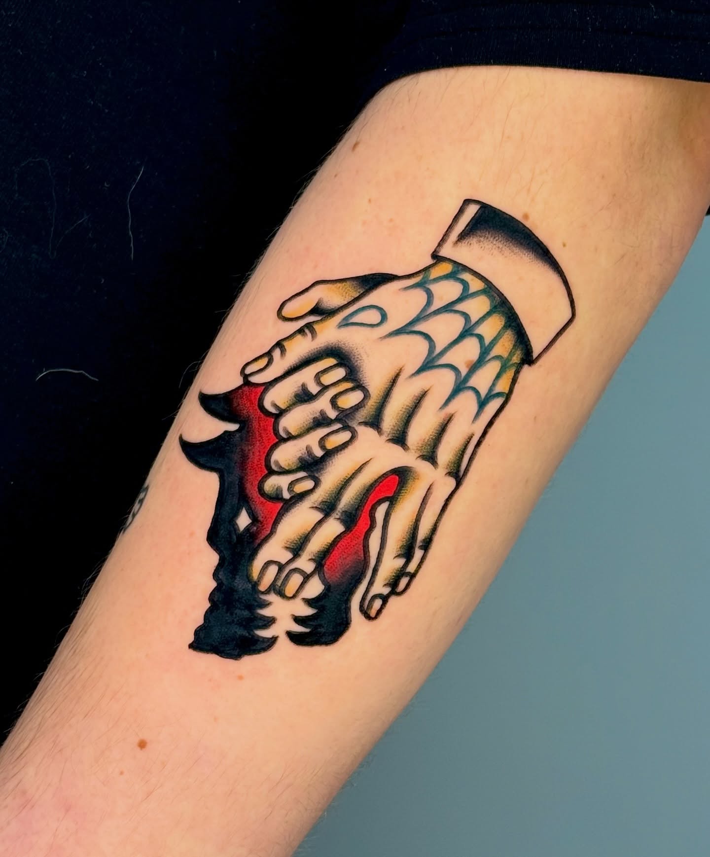 Hands American traditional tattoo on the forearm by Tattooer Sancho 🇰🇷🇨🇦