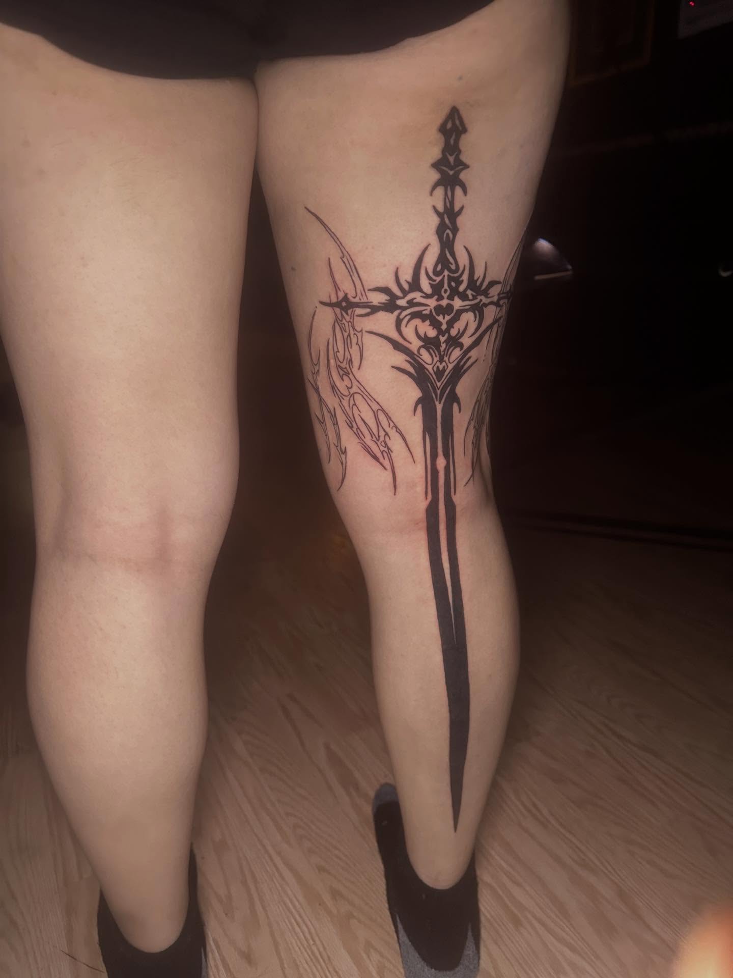 Sword tribal tattoo on the thigh by Javierr Jimenezz