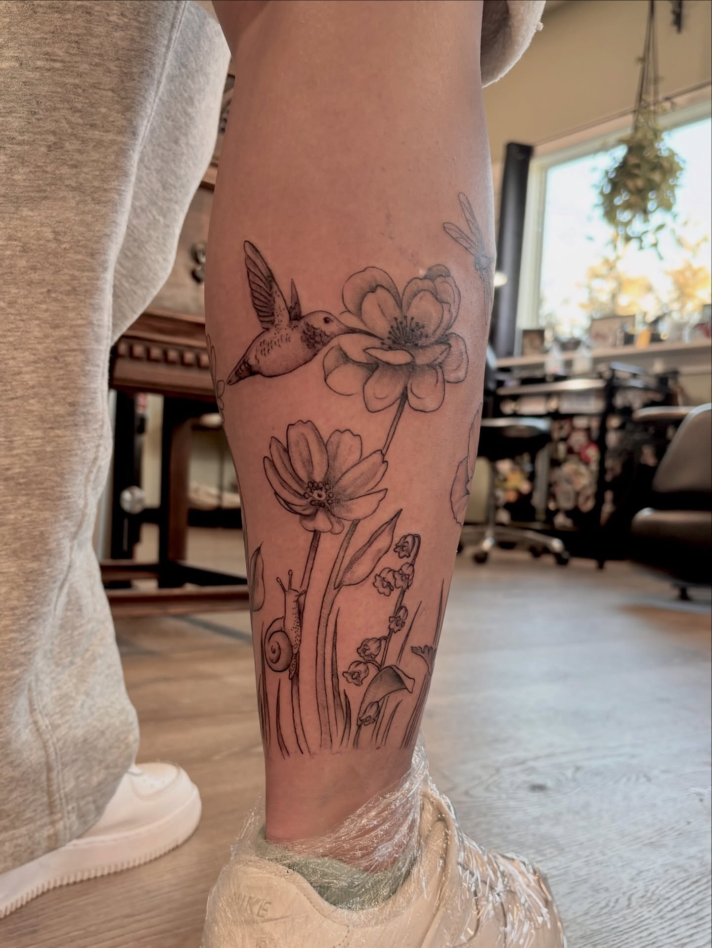 Hummingbird and flowers black and grey tattoo on the forearm by Sage Ray ♡