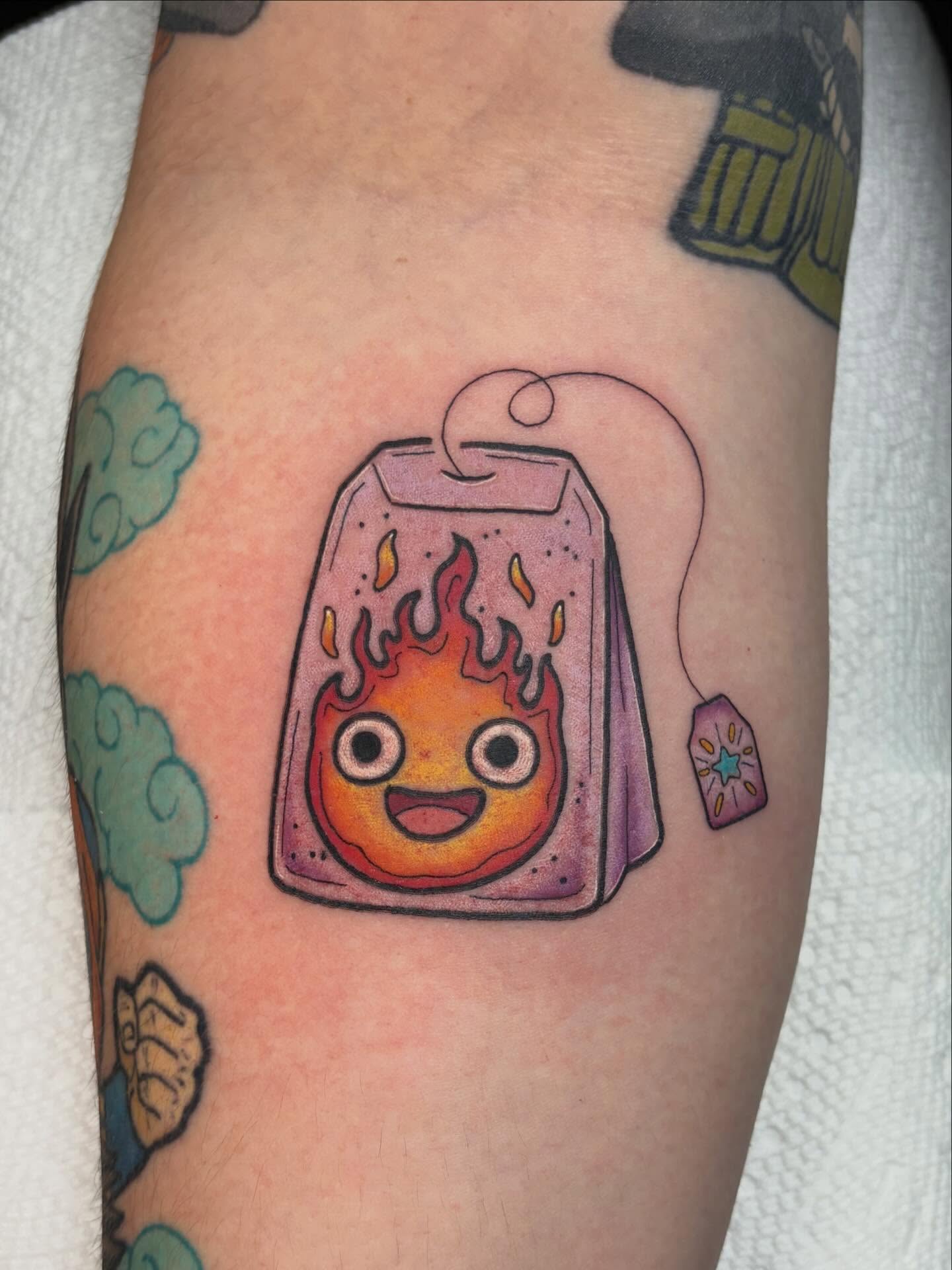 Flaming tea bag new school tattoo on the forearm by ✦ 𝐊𝐚𝐢𝐭 ✦