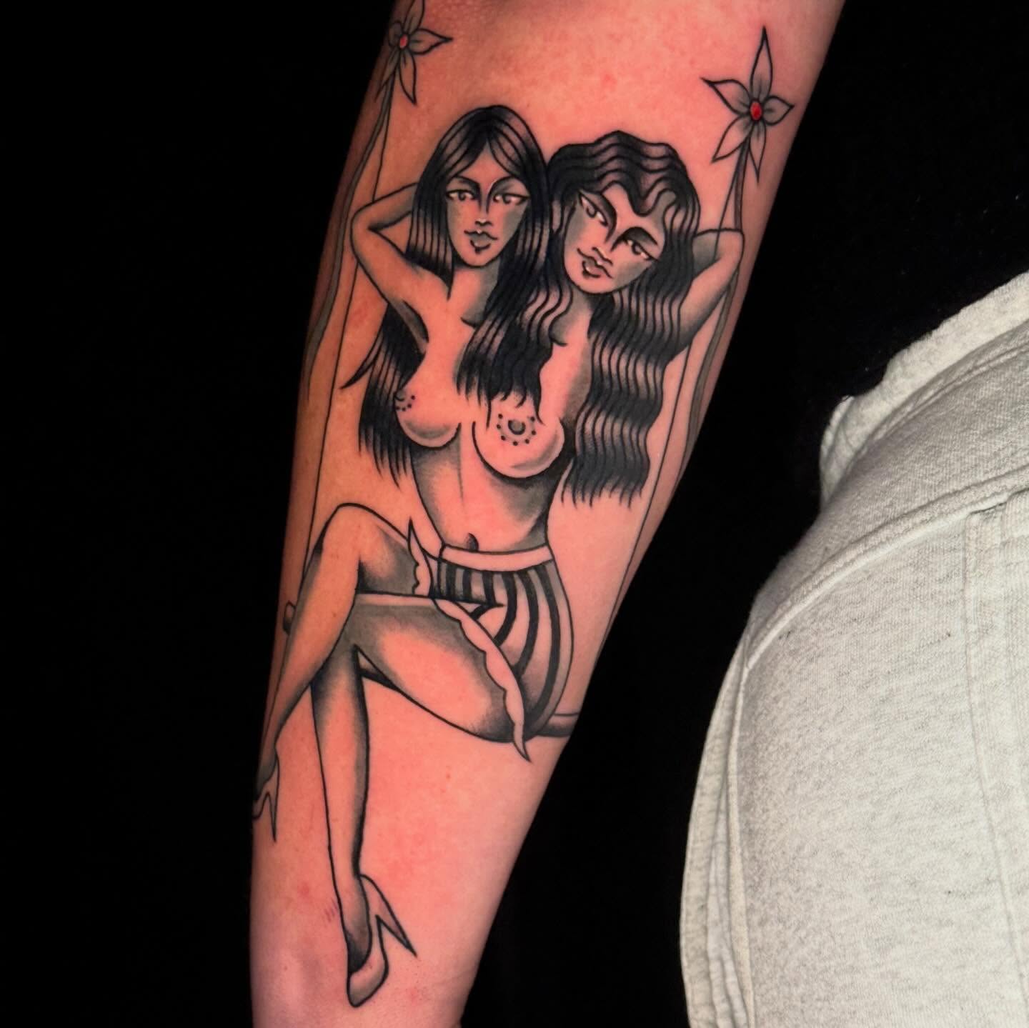 Nude women black and grey tattoo on the forearm by Mallory Brown