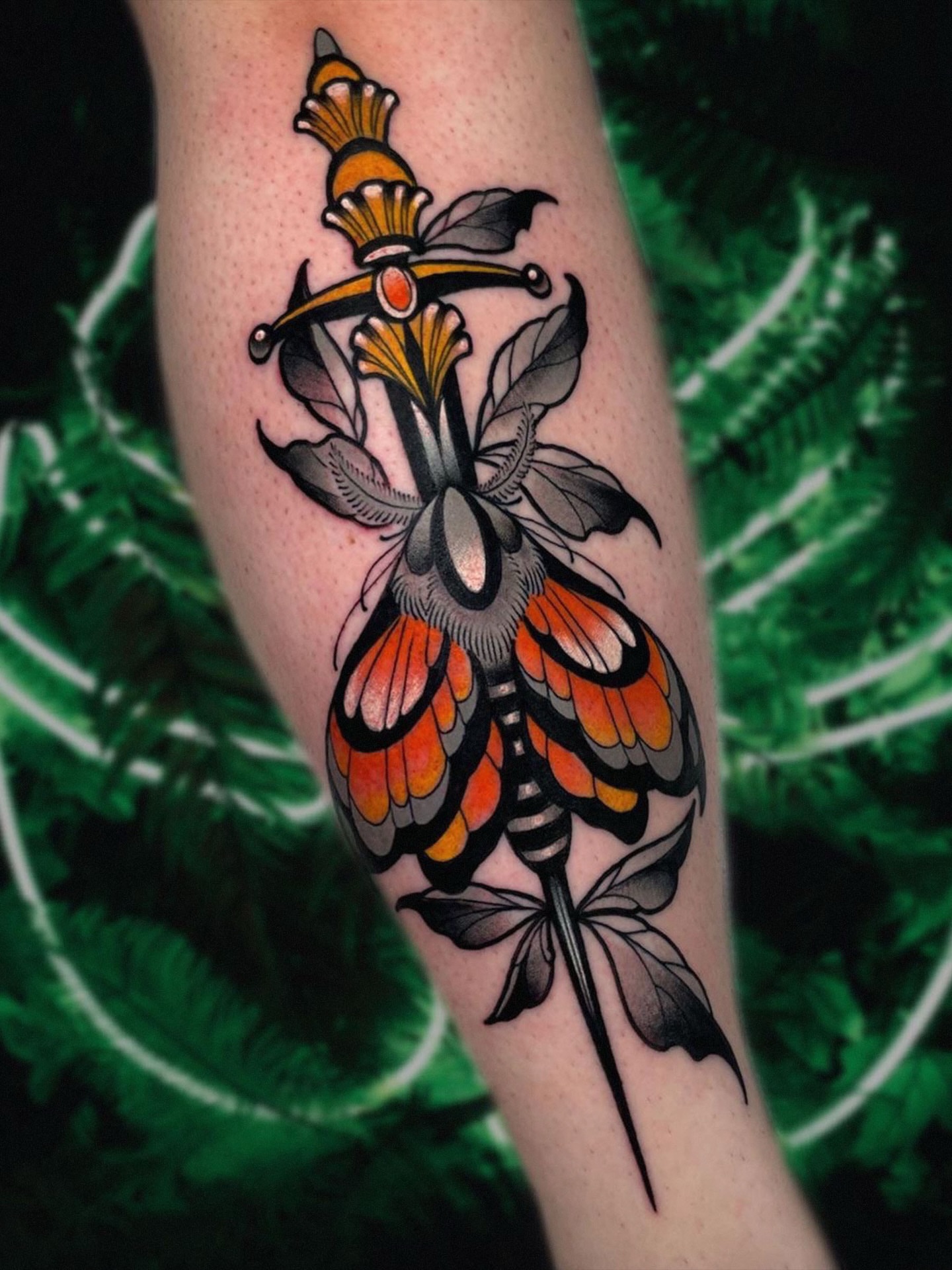 Butterfly and sword American traditional tattoo on the forearm by Shane Klos