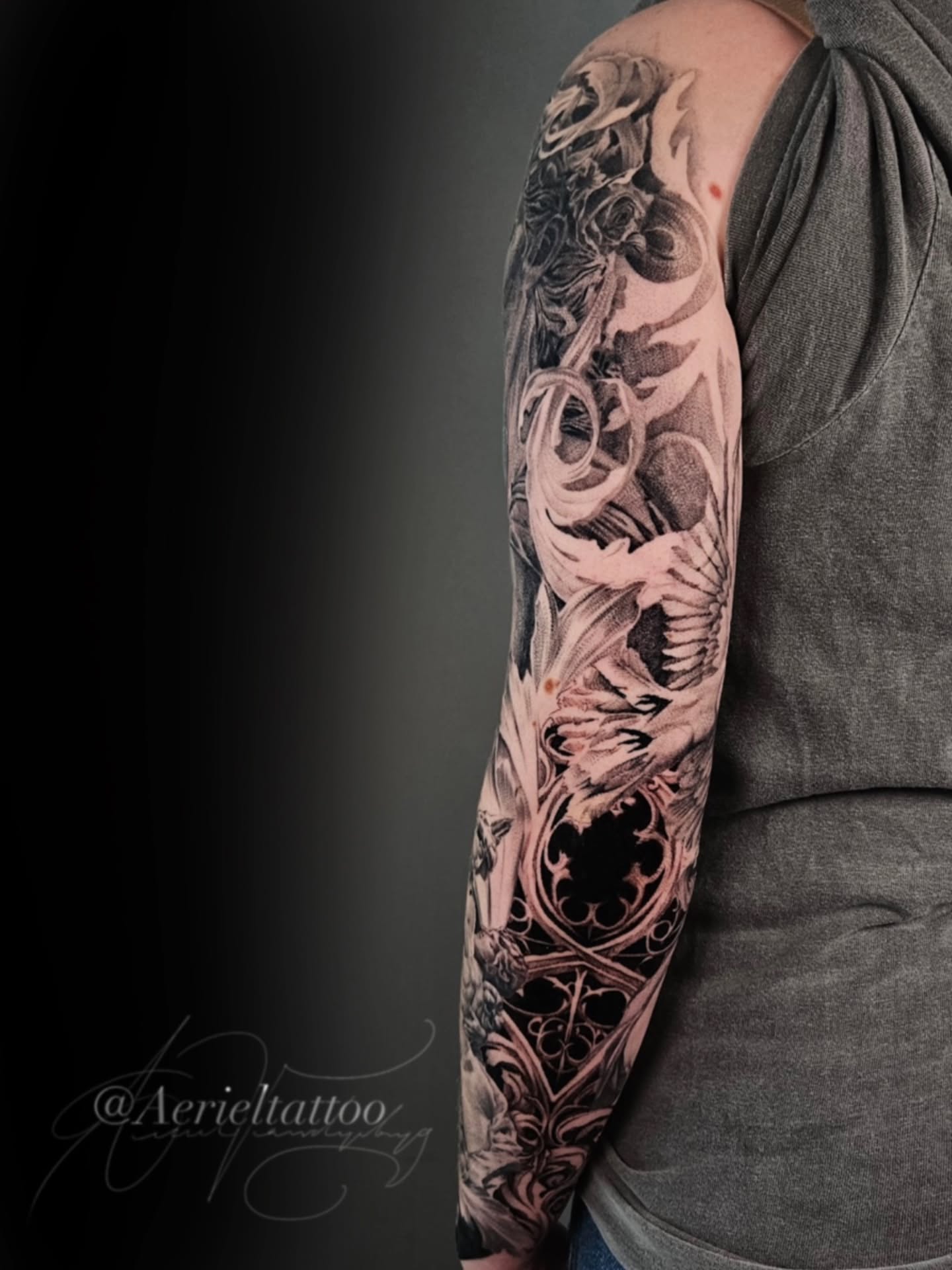 Dragon and flames realism tattoo on the upper arm by Dallas Tattoo artist