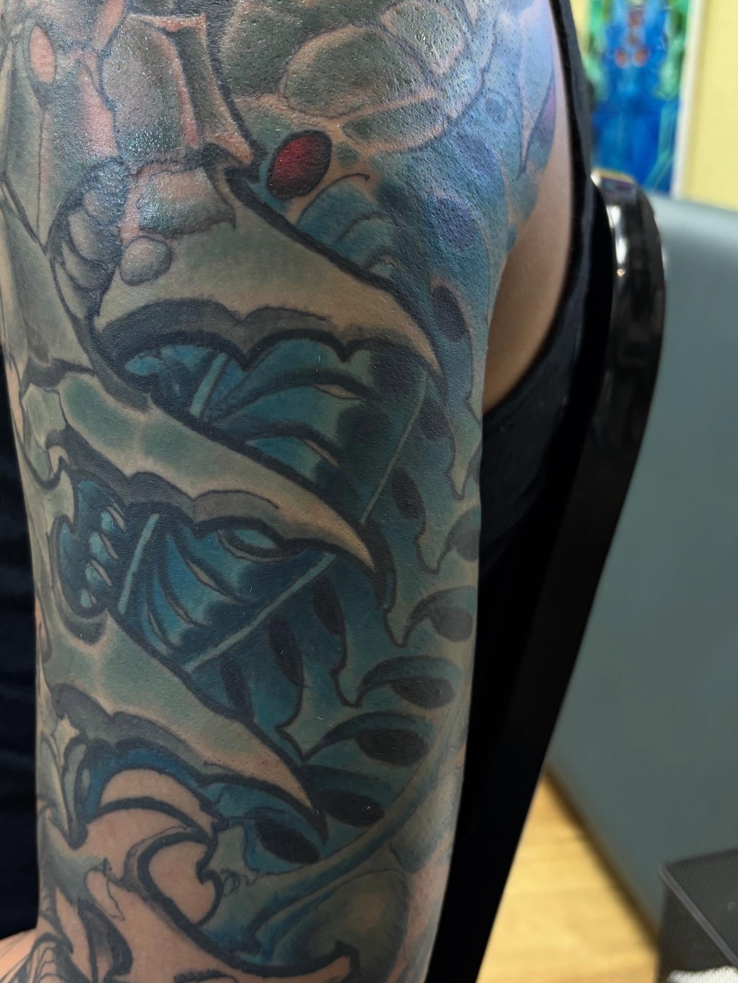 Mask American traditional tattoo on the forearm by Rene Chavira