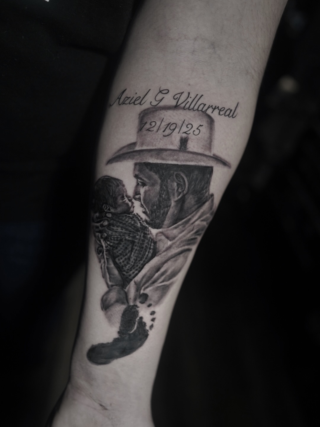 Father and child realism tattoo on the forearm by Niko Hosk Cataldo