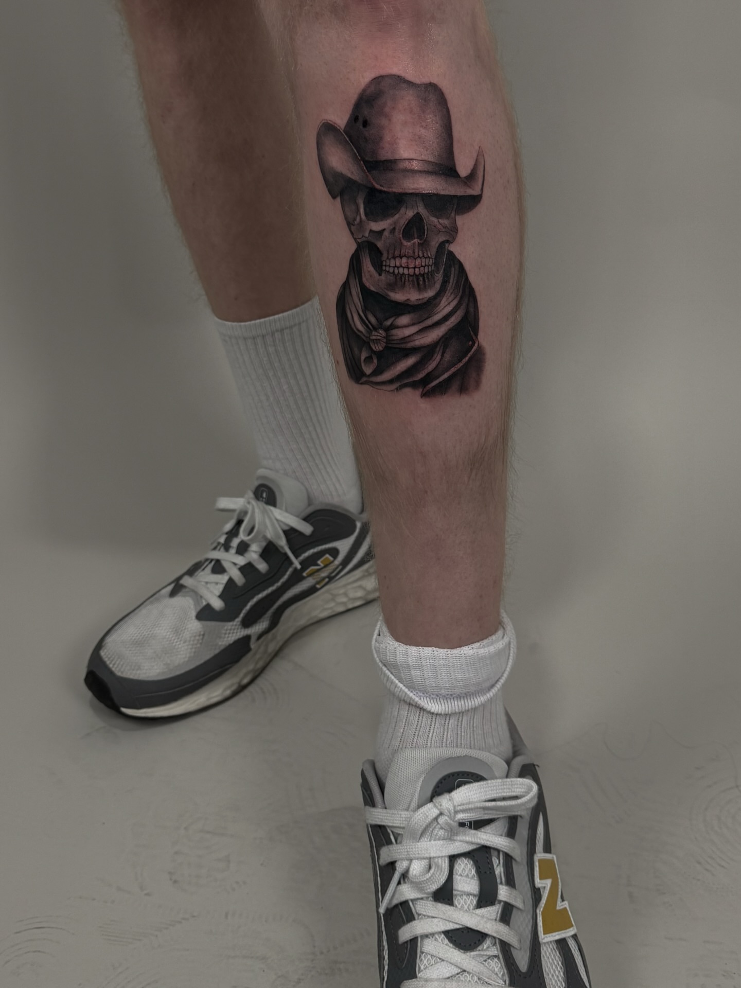 Cowboy skull realism tattoo on the calf by sabina