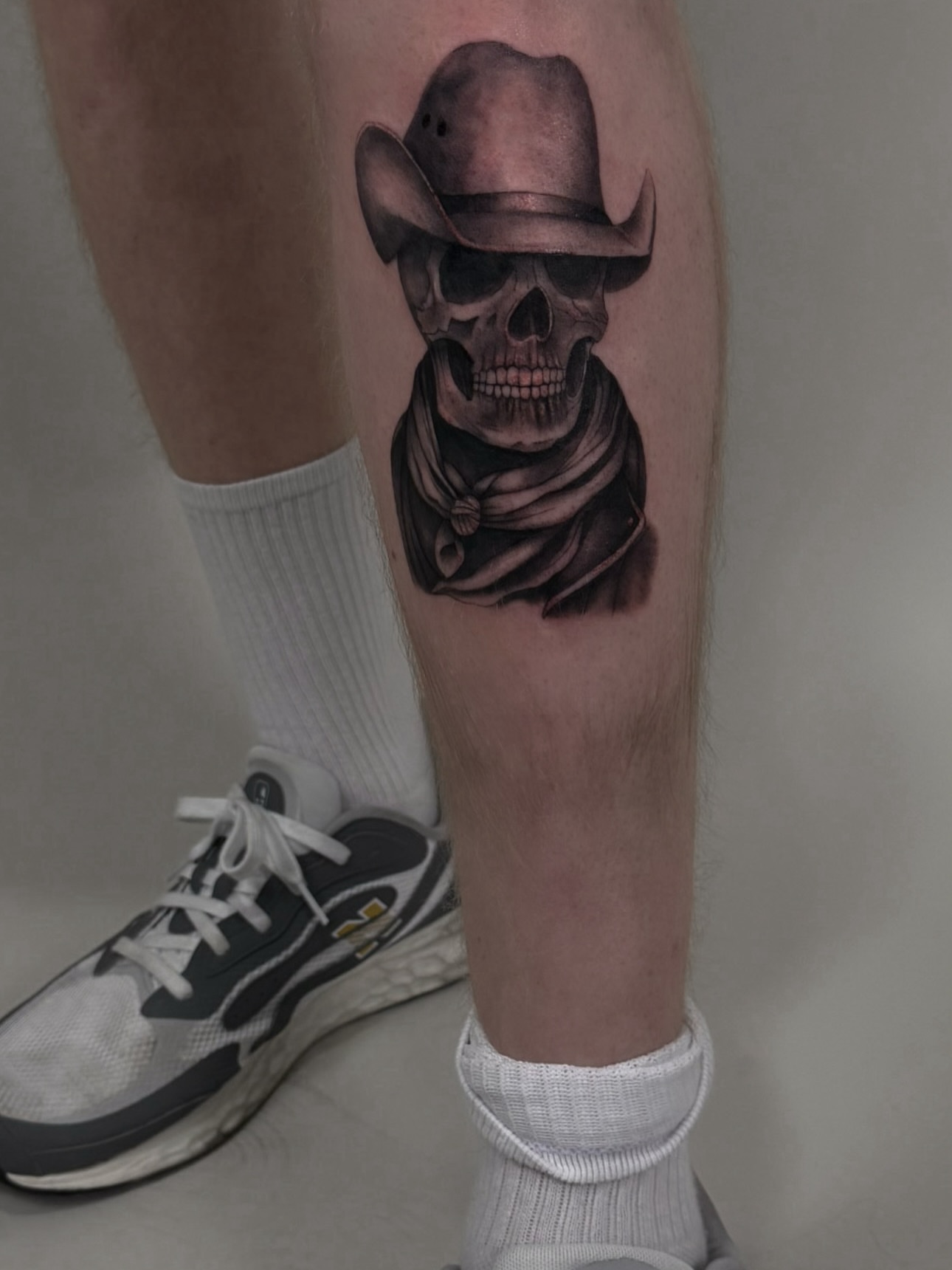 Cowboy skull realism tattoo on the calf by sabina