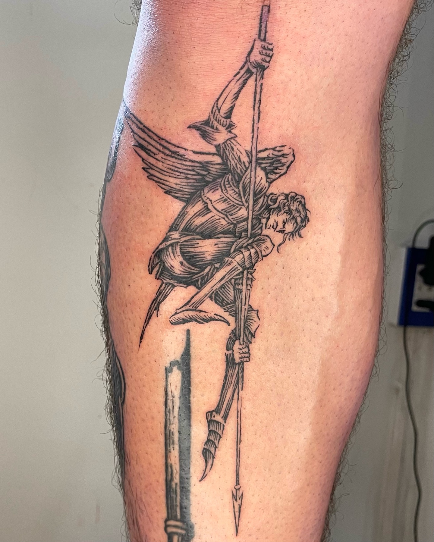Angelic warrior realism tattoo on the calf by Anh Đan