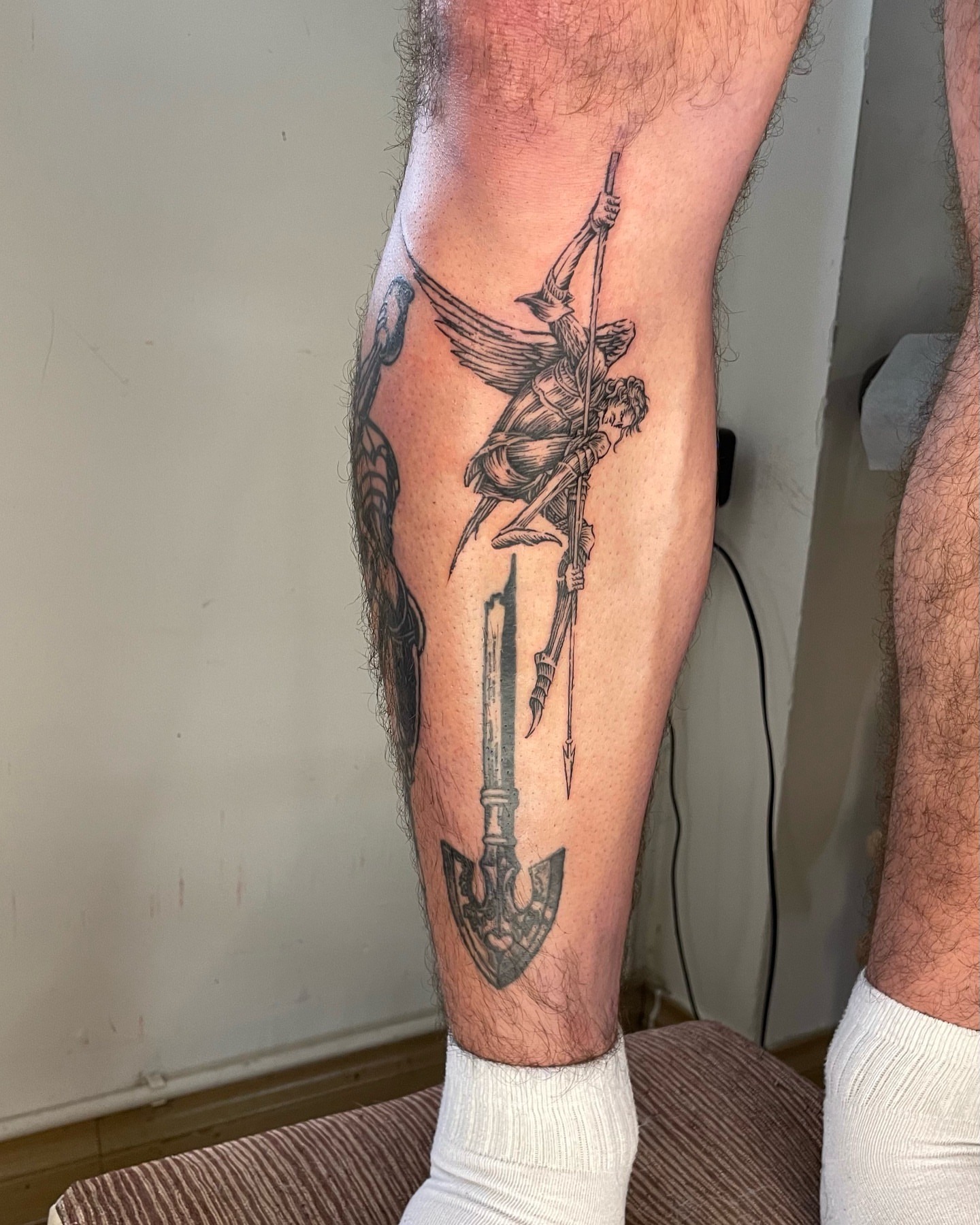 Warrior with spear black and grey tattoo on the calf by Anh Đan