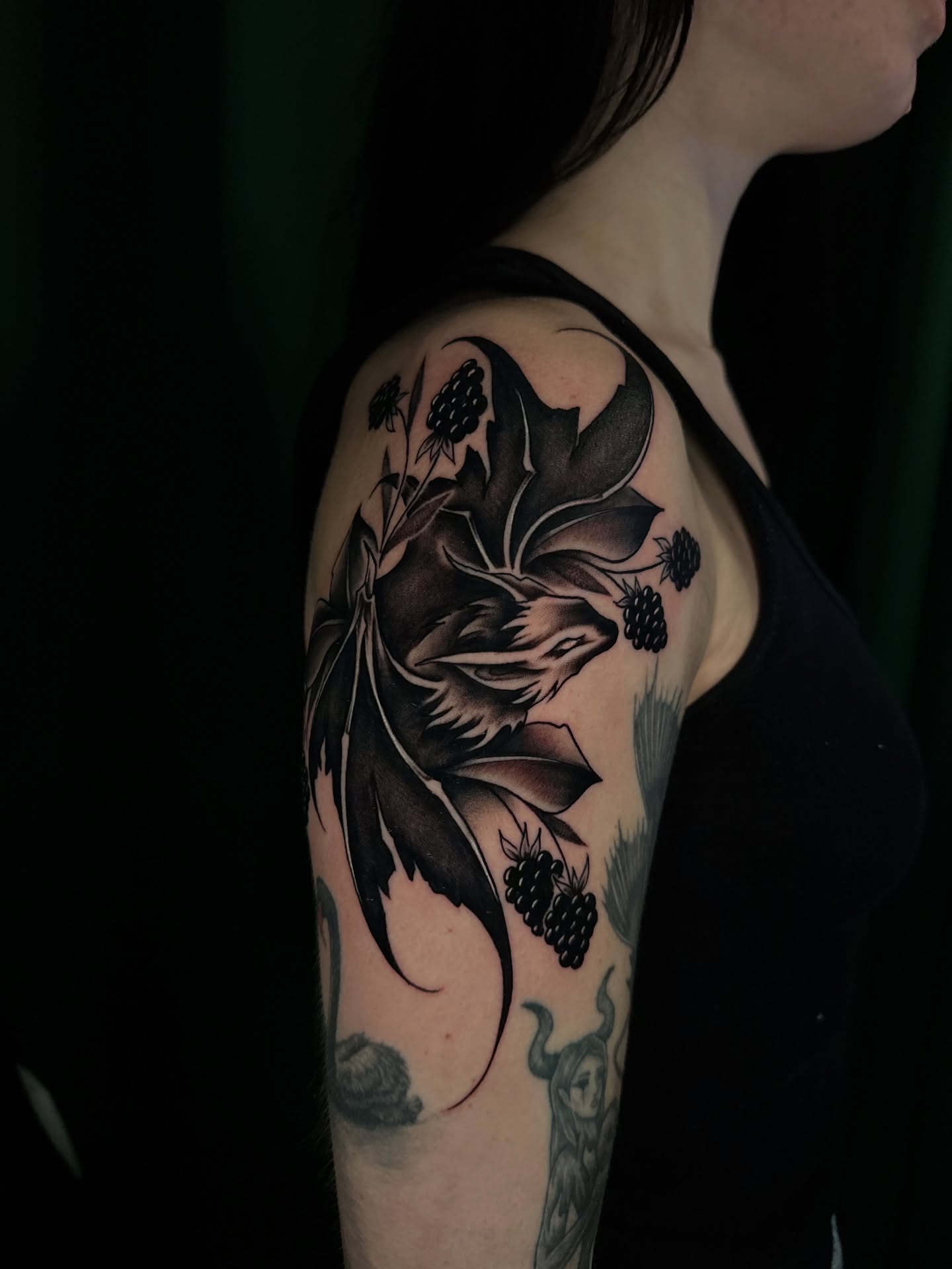 Blackberry plant black and grey tattoo on the shoulder by Sam Minneci