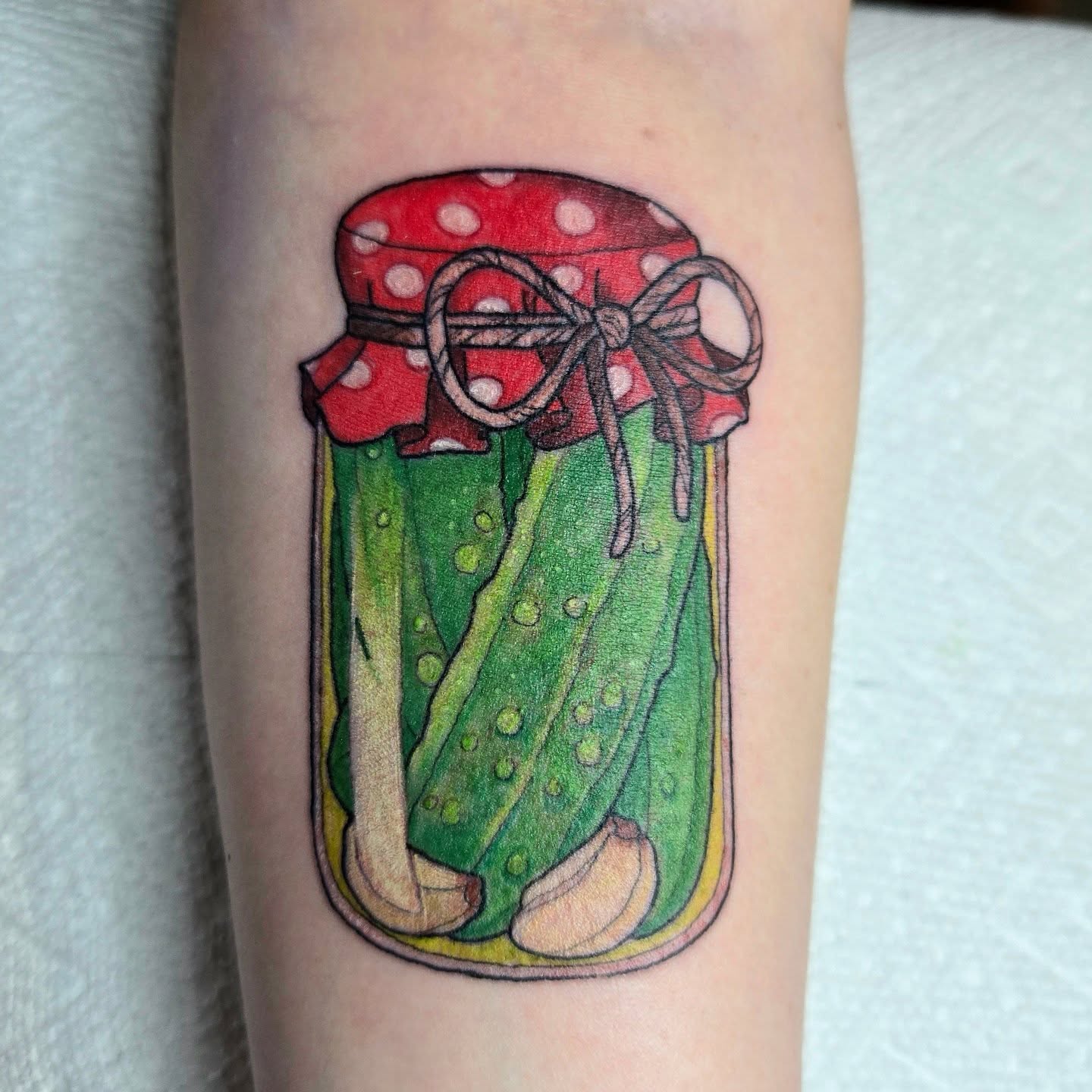 Pickle jar dotwork tattoo on the forearm by Amanda Hinrichs