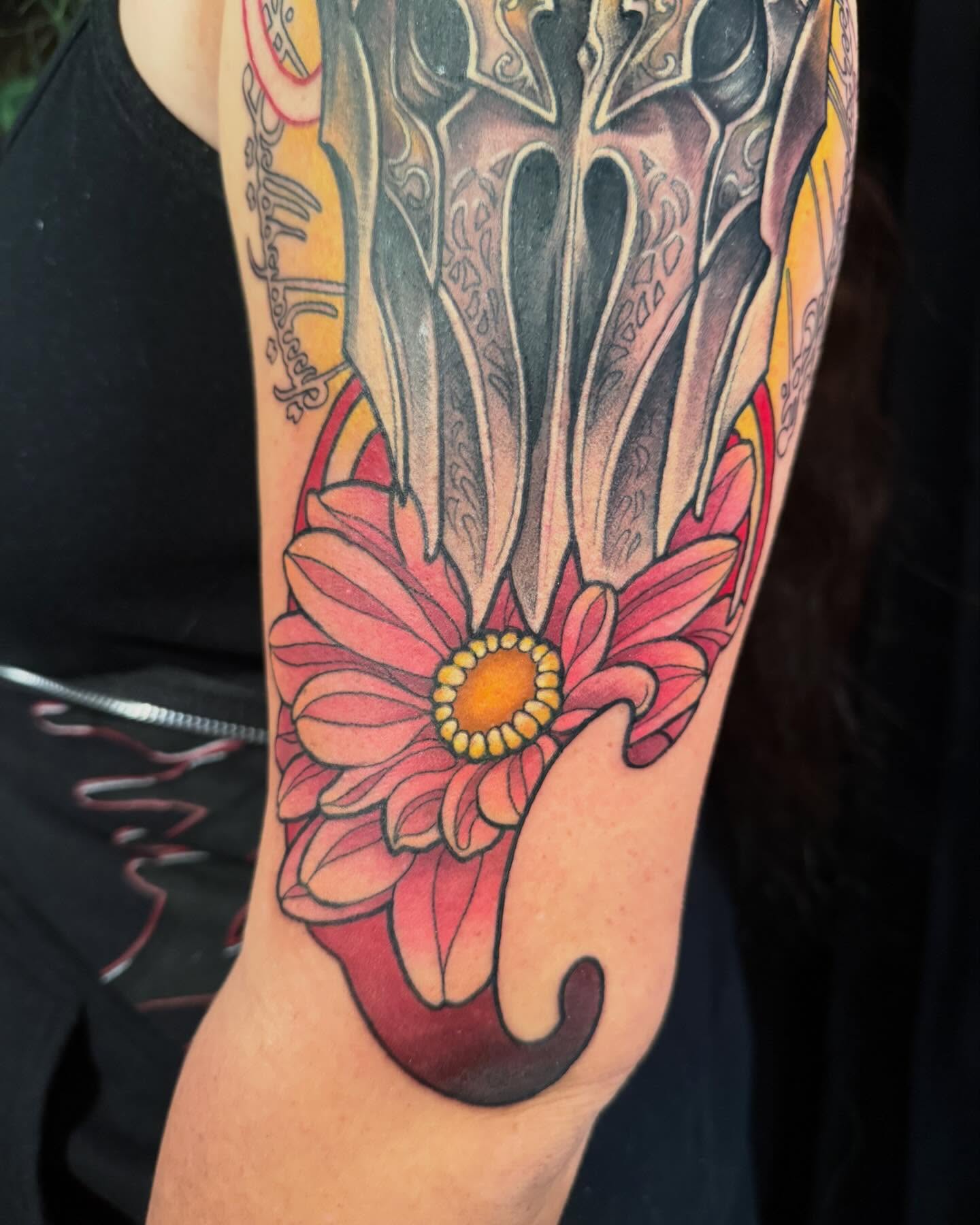 Flower and sword neo-traditional tattoo on the forearm by Jade Lewis