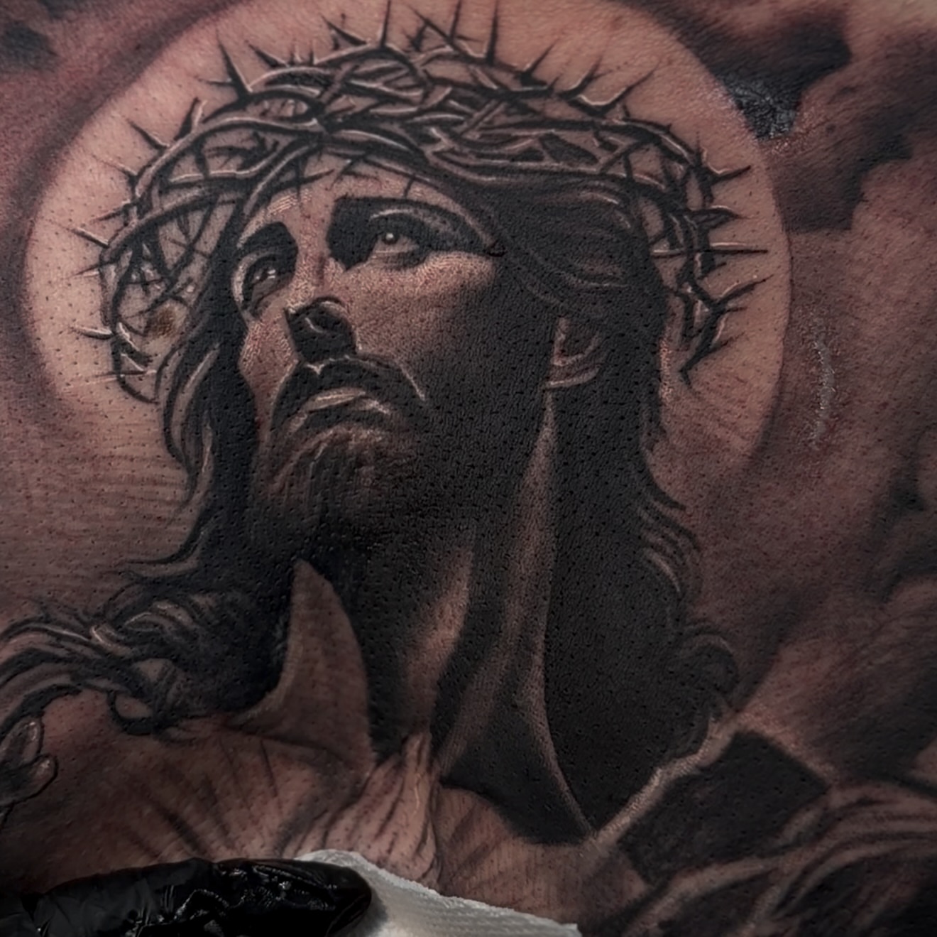 Jesus Christ realism tattoo on the chest by Raul Rodriguez