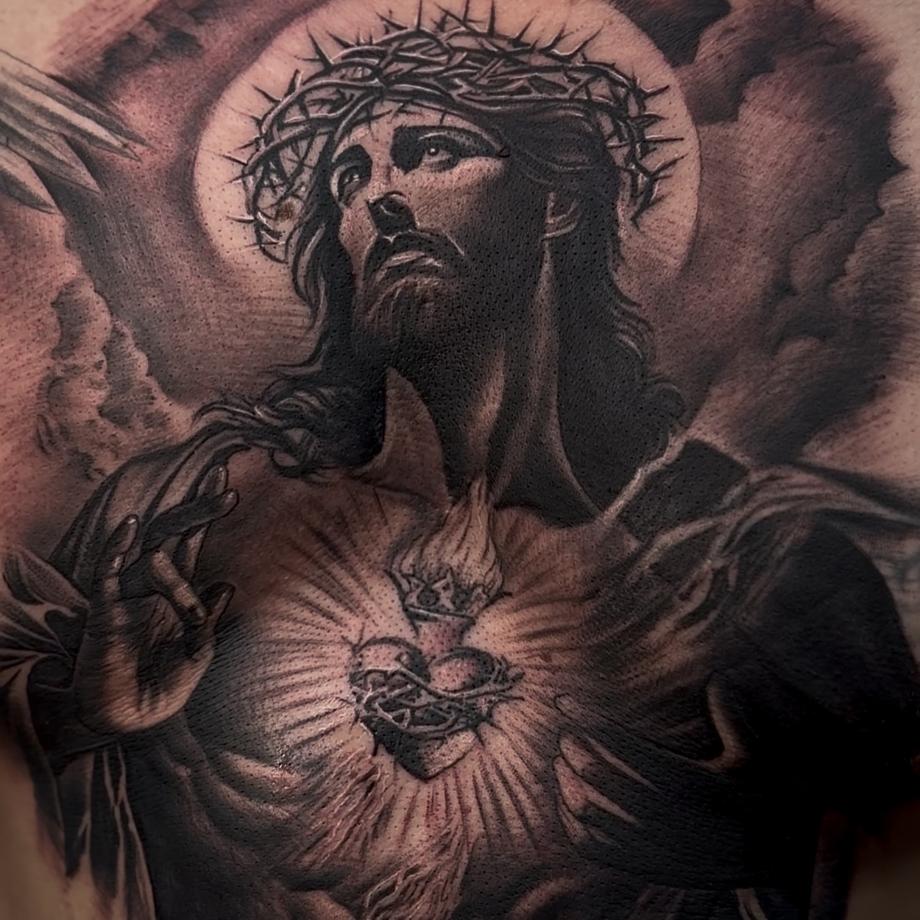 Jesus Christ dotwork tattoo on the chest by Raul Rodriguez
