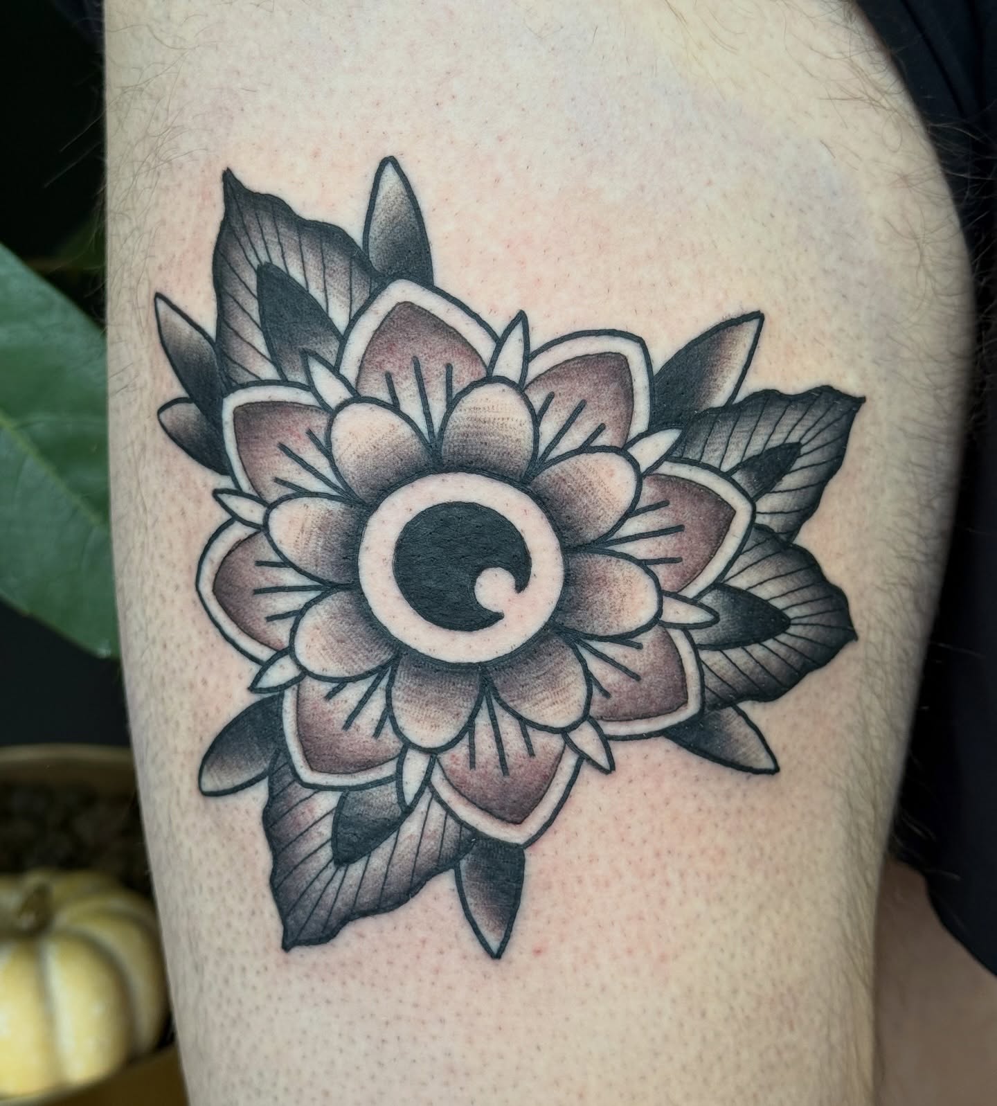 Flower American traditional tattoo on the thigh by Kelsey Louis, Iowa City, Iowa