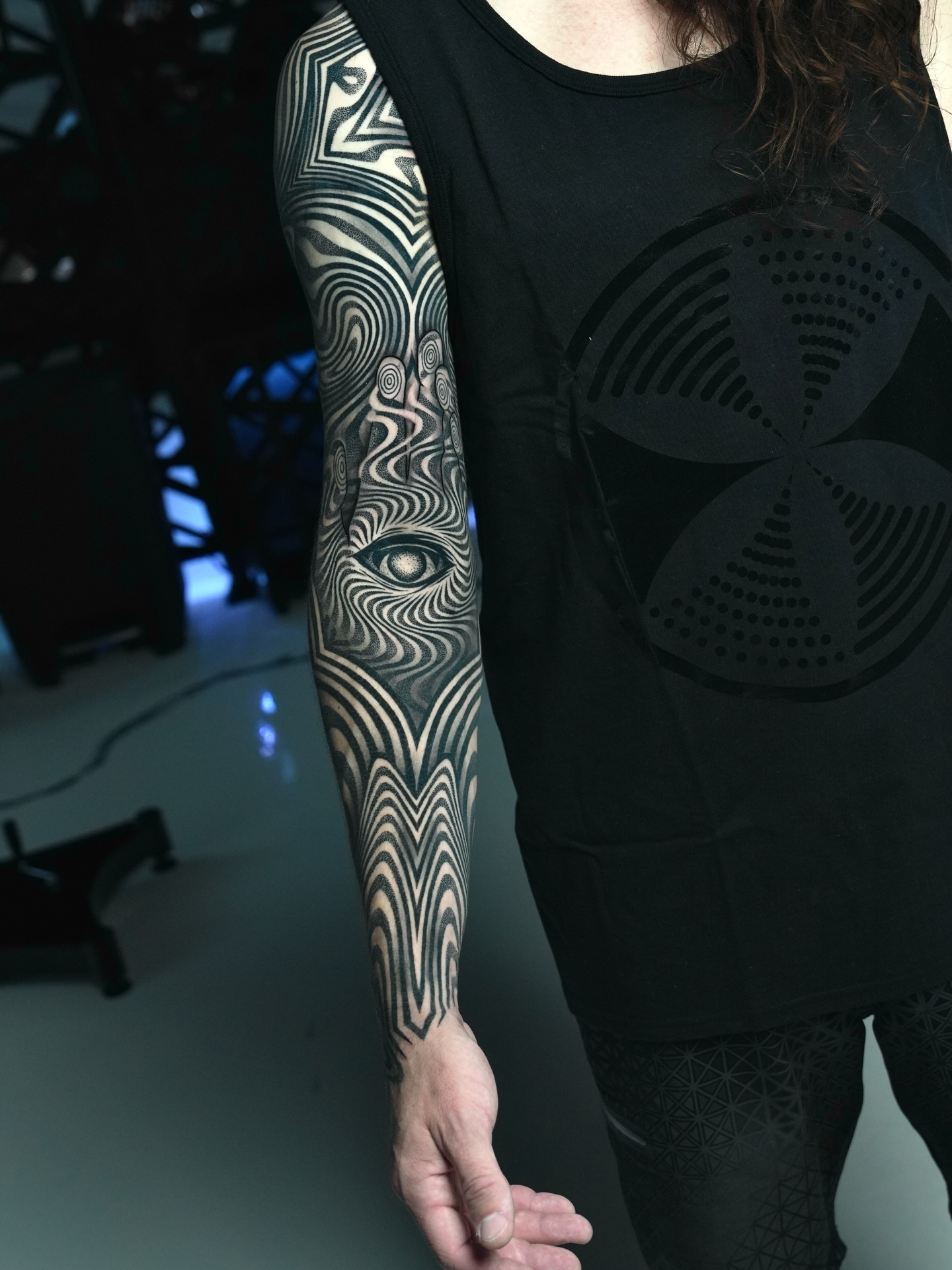 Abstract eye pattern geometric tattoo on the forearm by Ilya Cascad Kandaurov