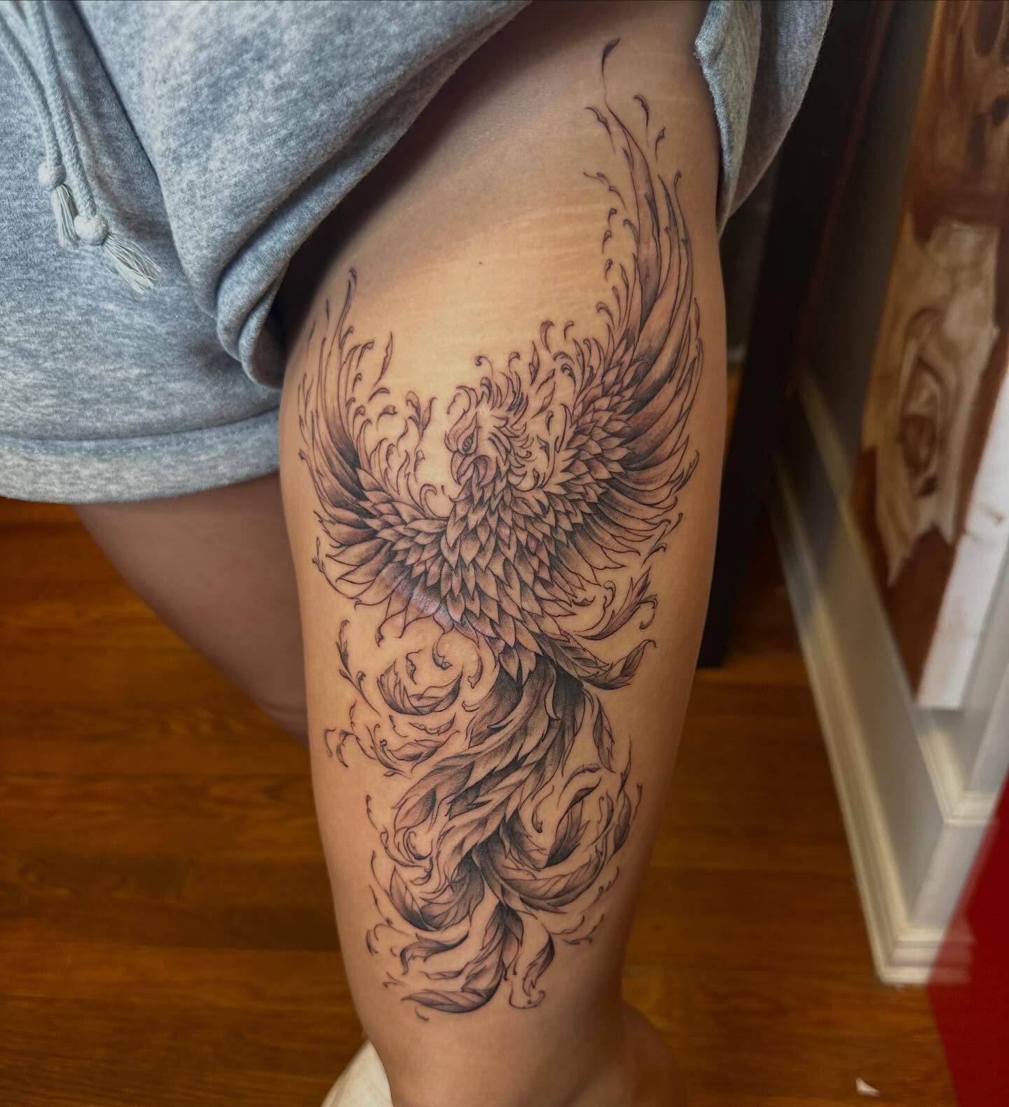 Phoenix black and grey tattoo on the thigh by Raul Najera Tattoo, Plano, Texas