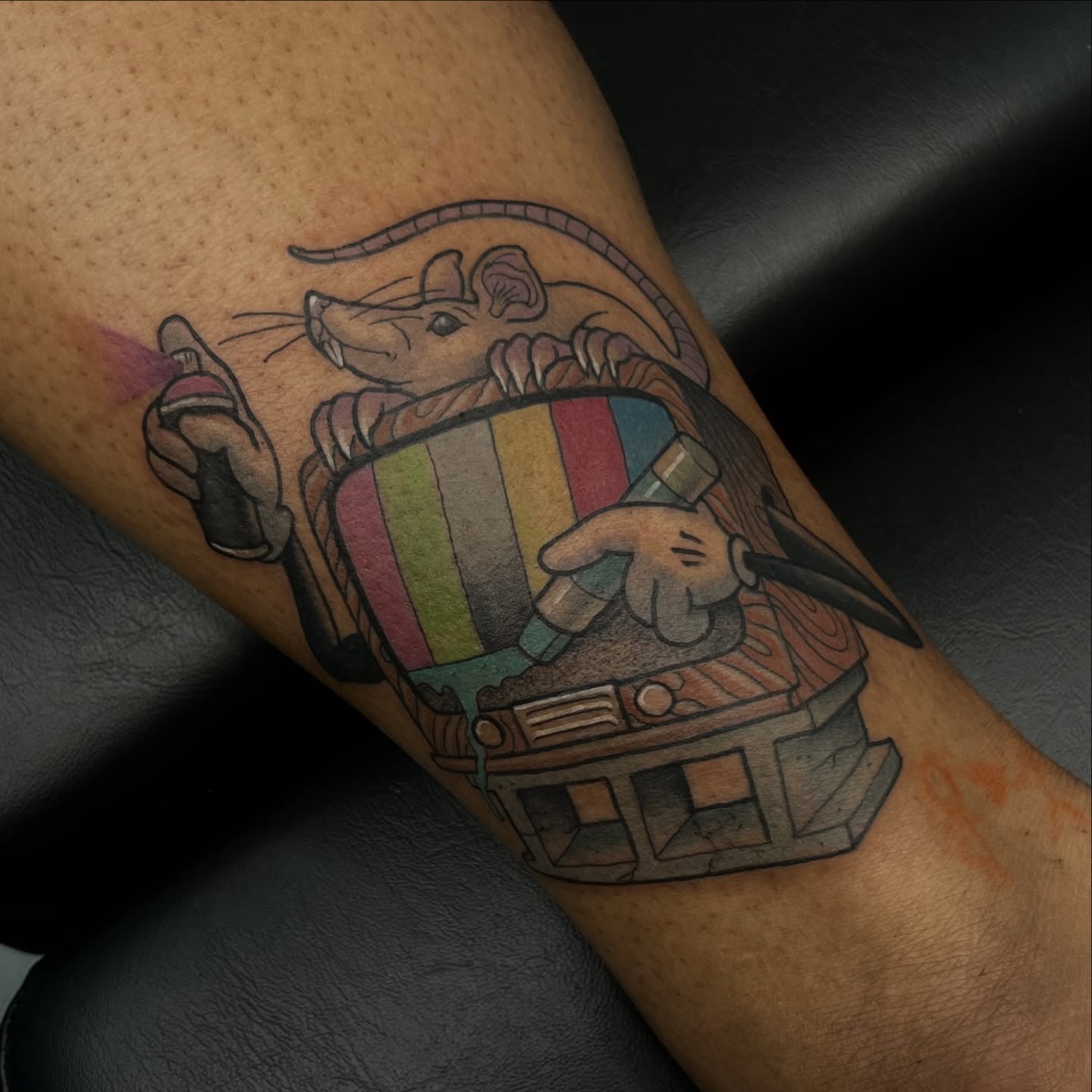Mouse with train American traditional tattoo on the forearm by Evan Perrine