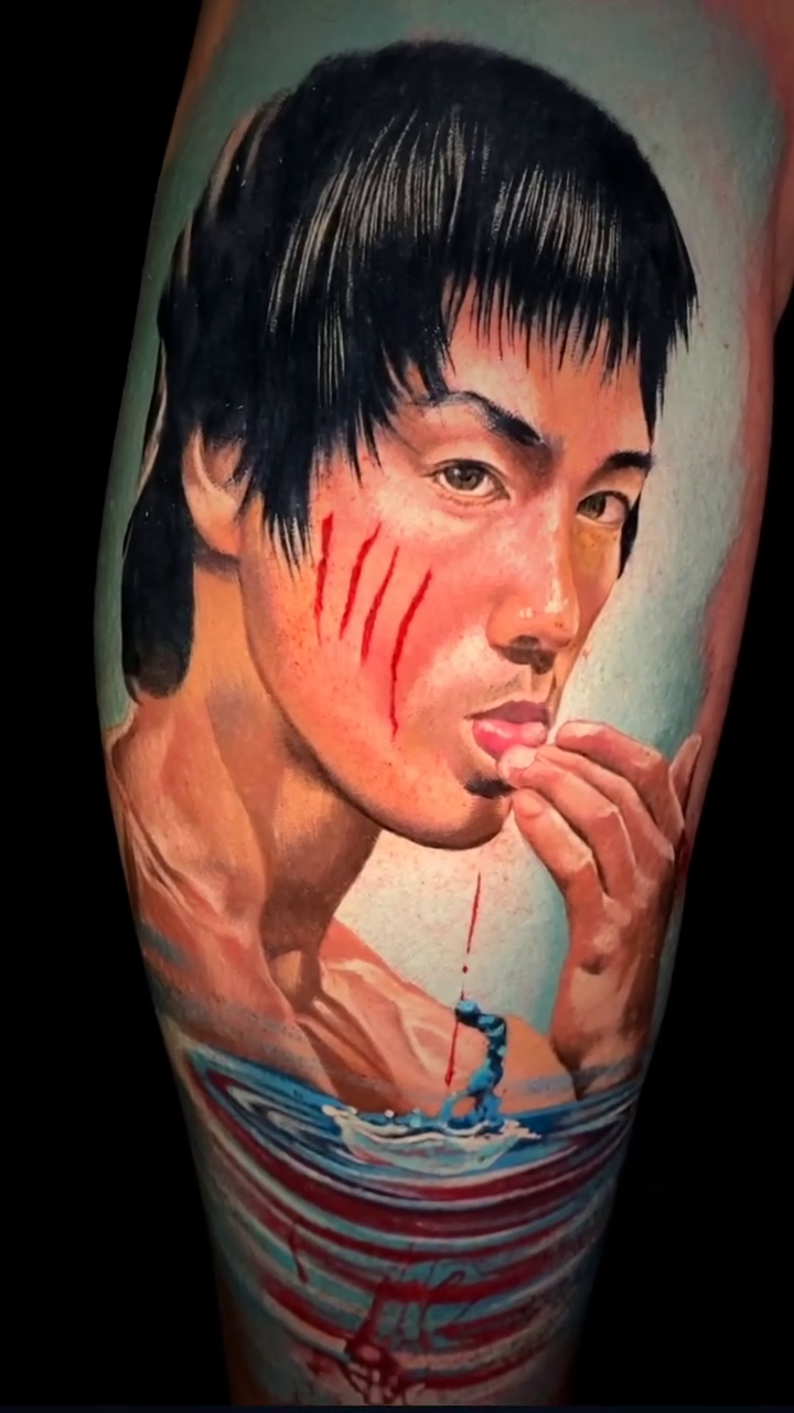 Bruce Lee in water with dragon realism tattoo by Noelin Wheeler