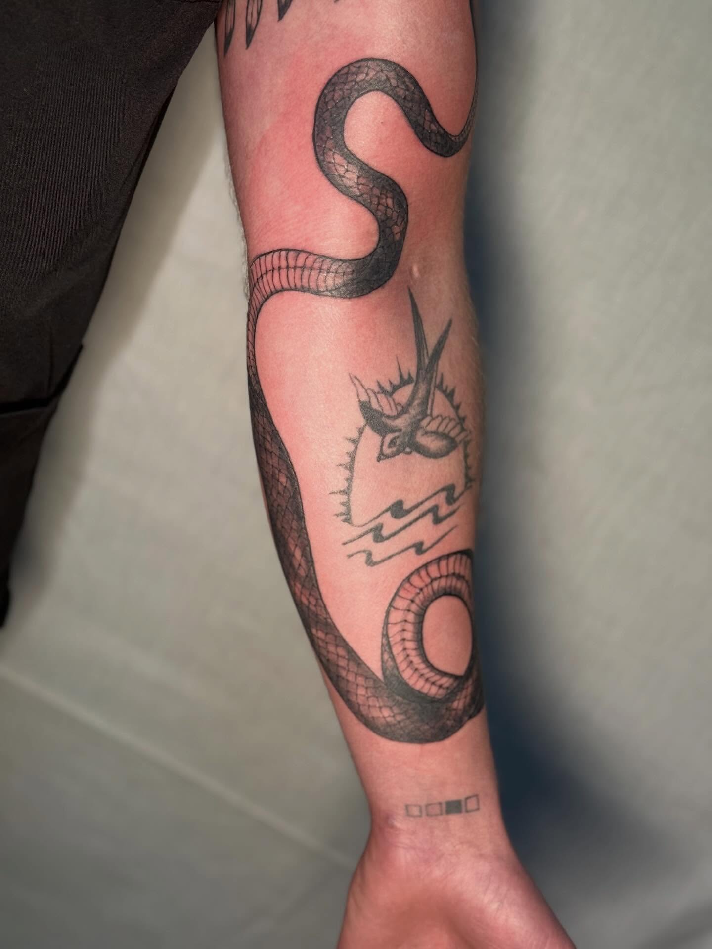 Snake realism tattoo on the forearm by Rachel Hanke