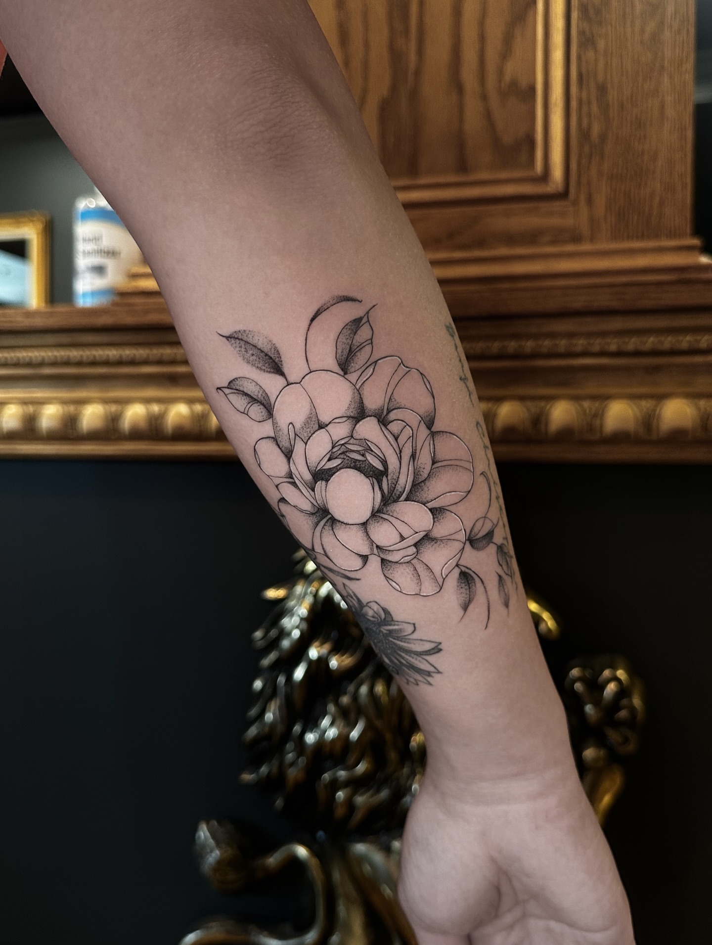Flower dotwork tattoo on the forearm by Leo Fernandes, Danvers, Massachusetts