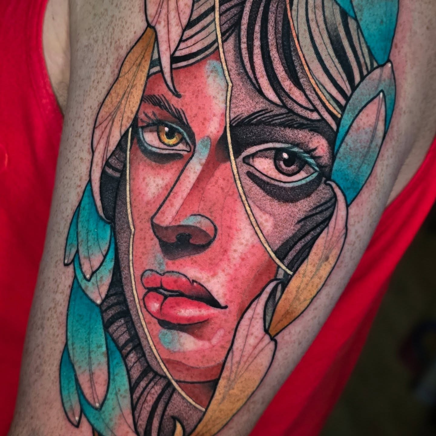 Abstract portrait geometric tattoo on the upper arm by Justin Eldridge