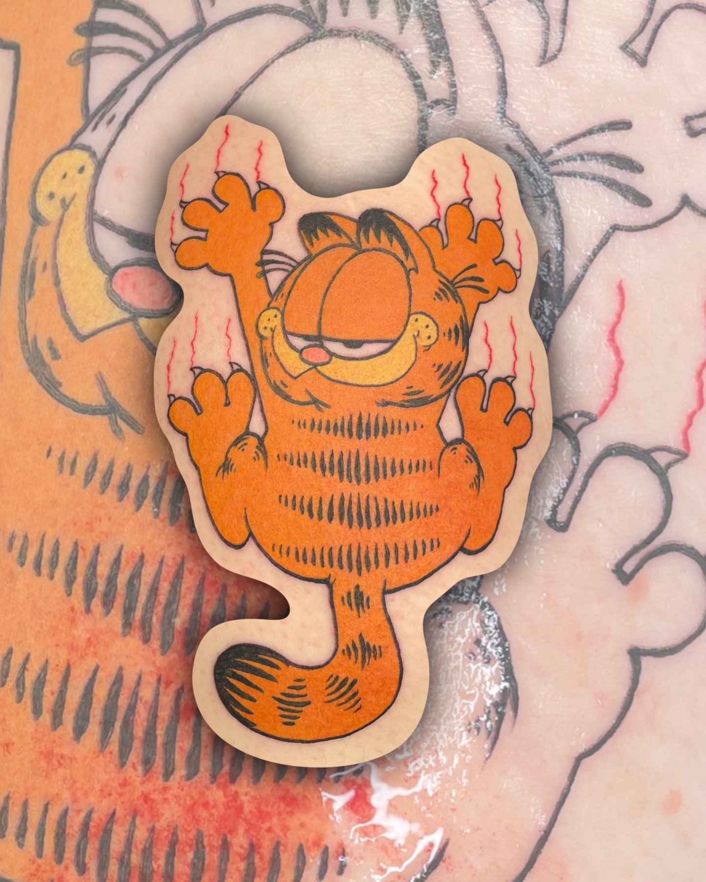 Garfield American traditional tattoo on the torso by Sydney “Goose “ Lange