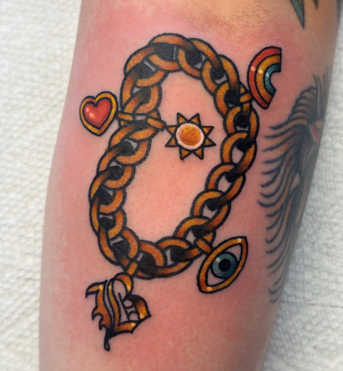 Chain with symbols American traditional tattoo on the forearm by 𝕷𝖆𝖚𝖗 𝕷𝖆𝖚𝖗