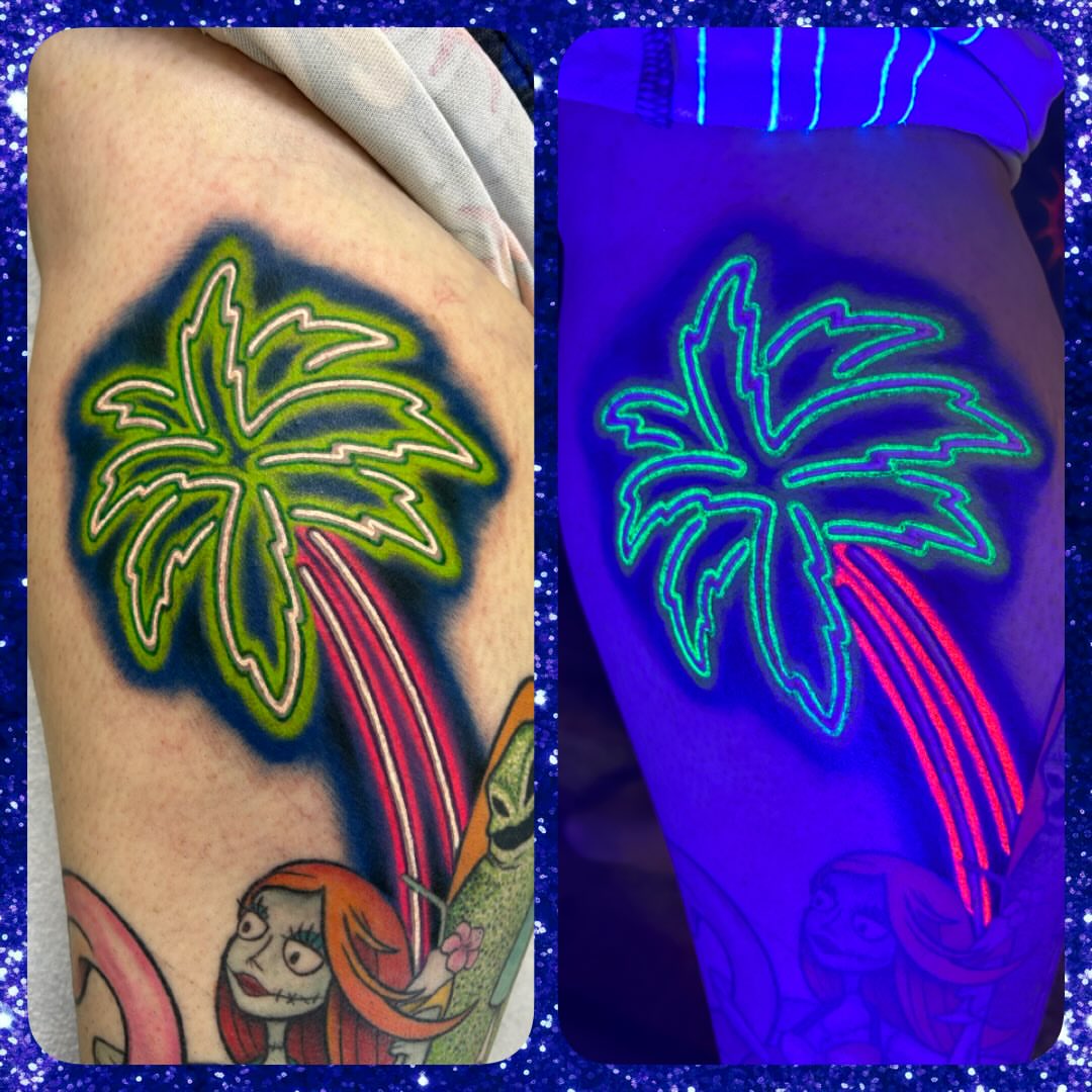 Palm tree tattoo on the thigh by Mary Rose Heckle