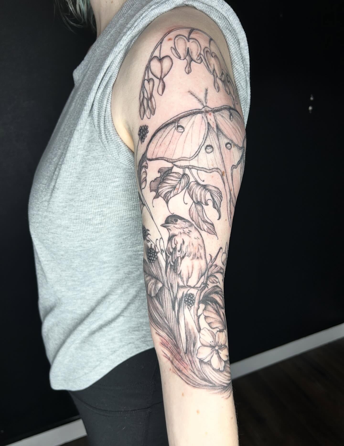 Bird and floral realism tattoo on the forearm by Elizabeth (Lib), Murfreesboro, Tennessee