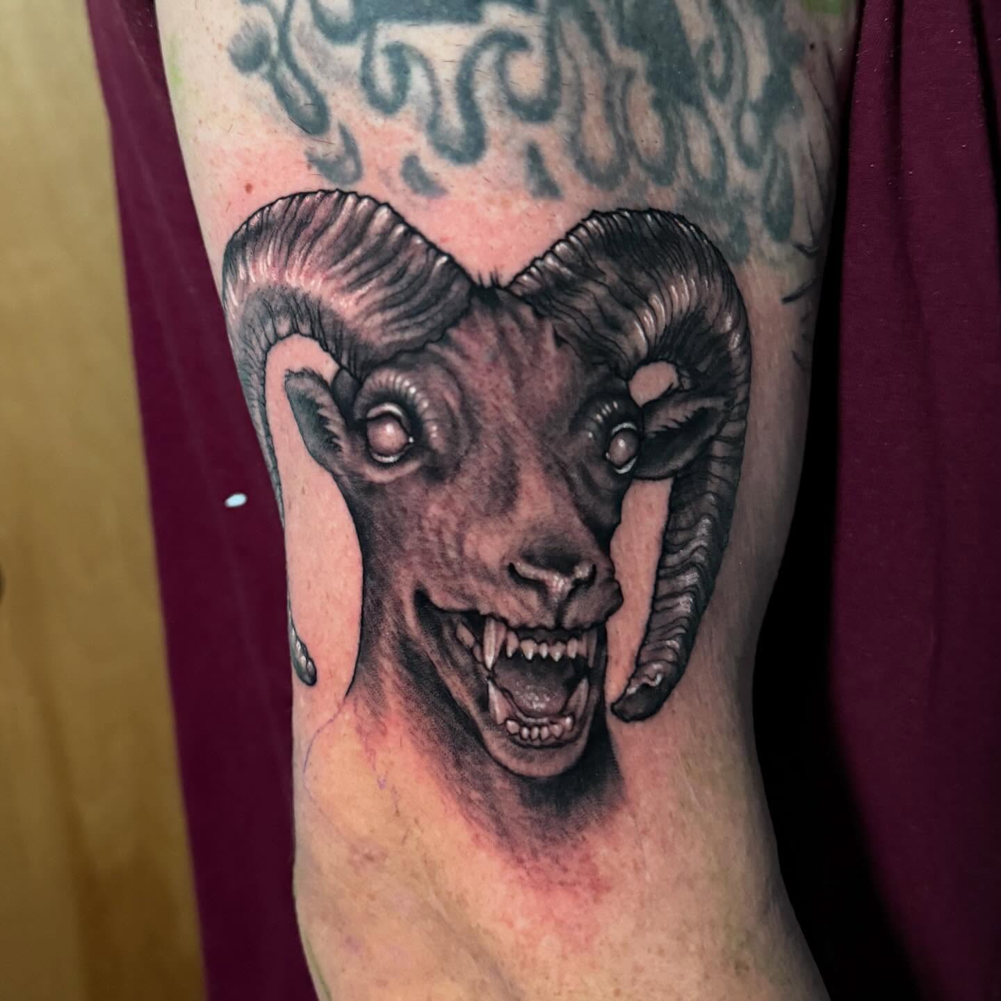 Ram head realism tattoo on the forearm by Bob Simmons