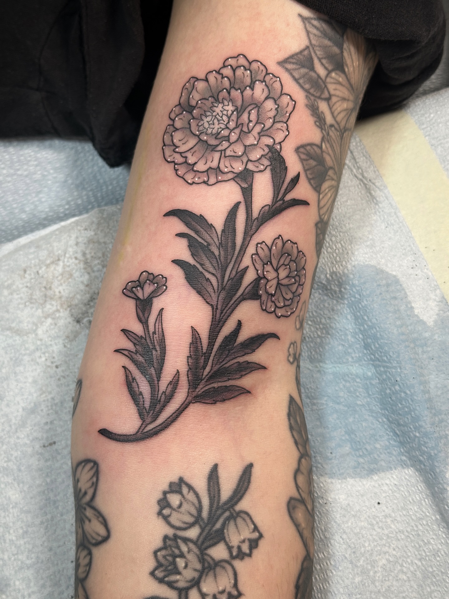 Peony flower black and grey tattoo on the forearm by Tattooing by Patty Valentine