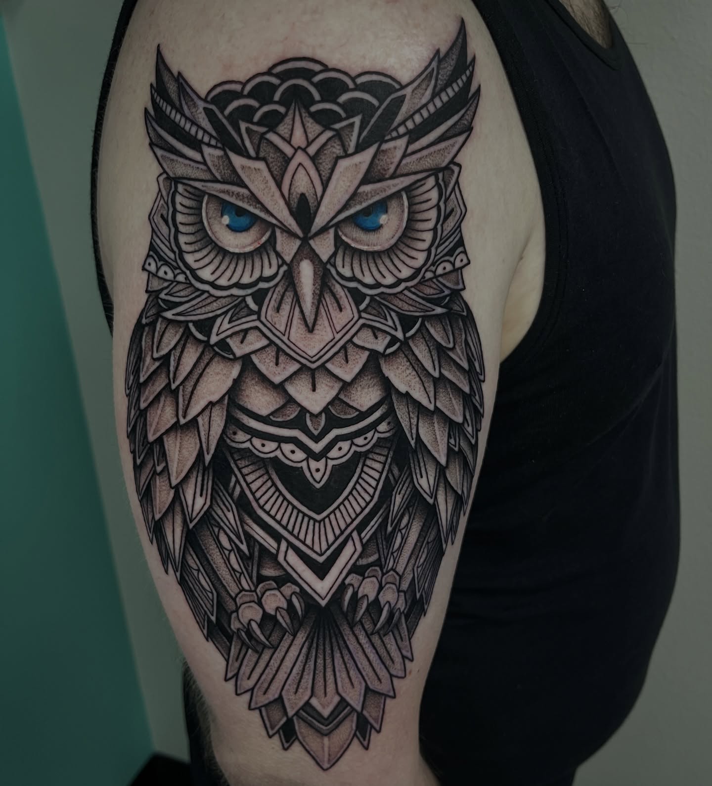 Owl geometric tattoo on the shoulder by Jordan Hunt