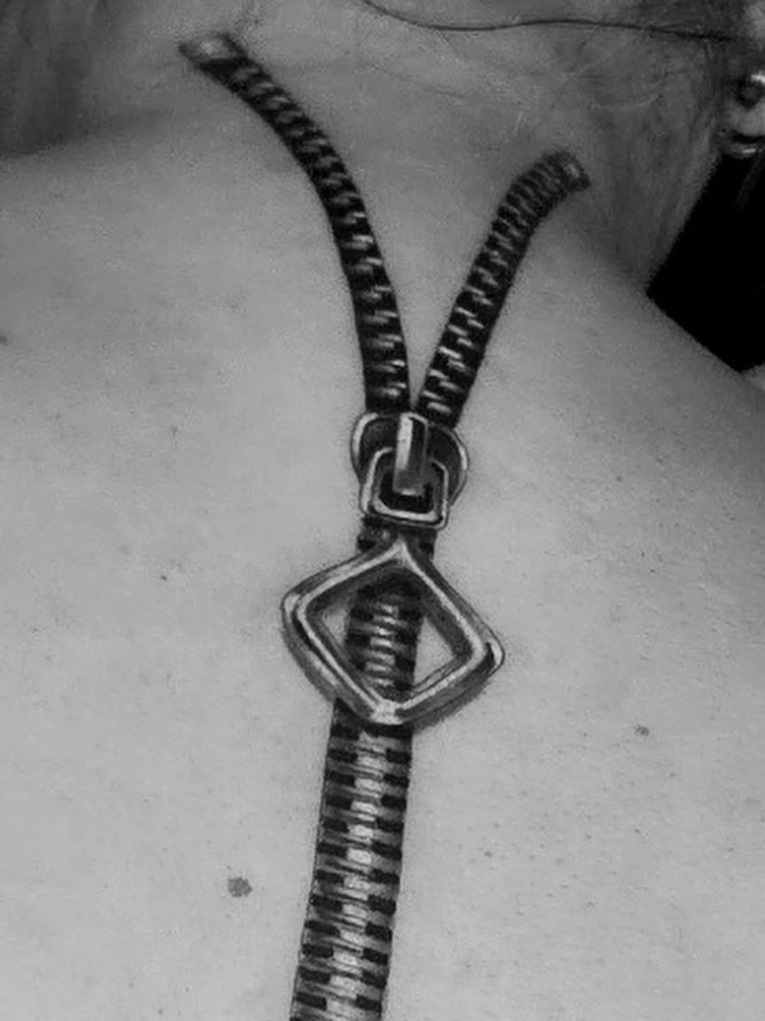 Zipper tattoo on the neck by Tattoo Artist