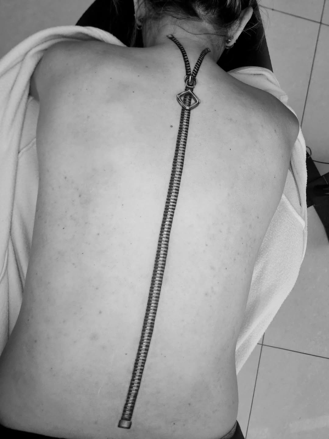 Zipper sketch tattoo on the back by Tattoo Artist