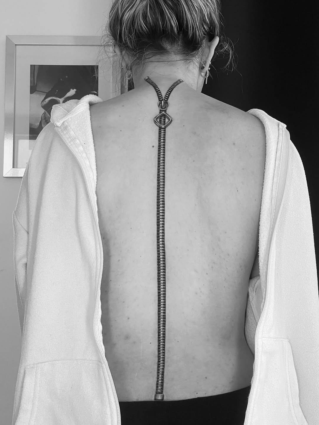 Zipper cyber sigilism tattoo on the back by Tattoo Artist