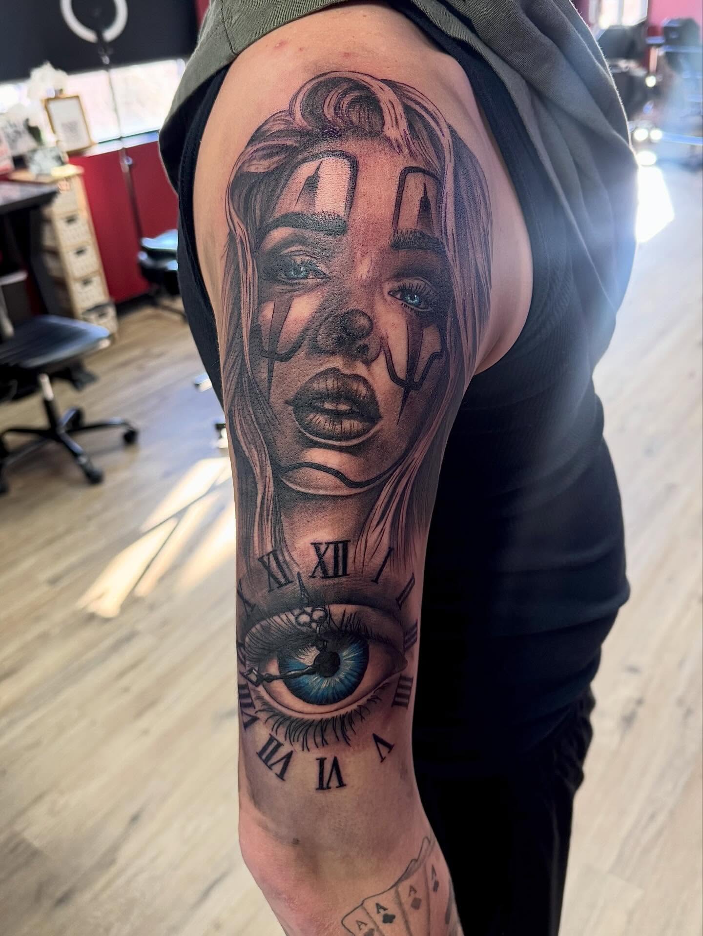Woman's face realism tattoo on the forearm by Robbie Bryant