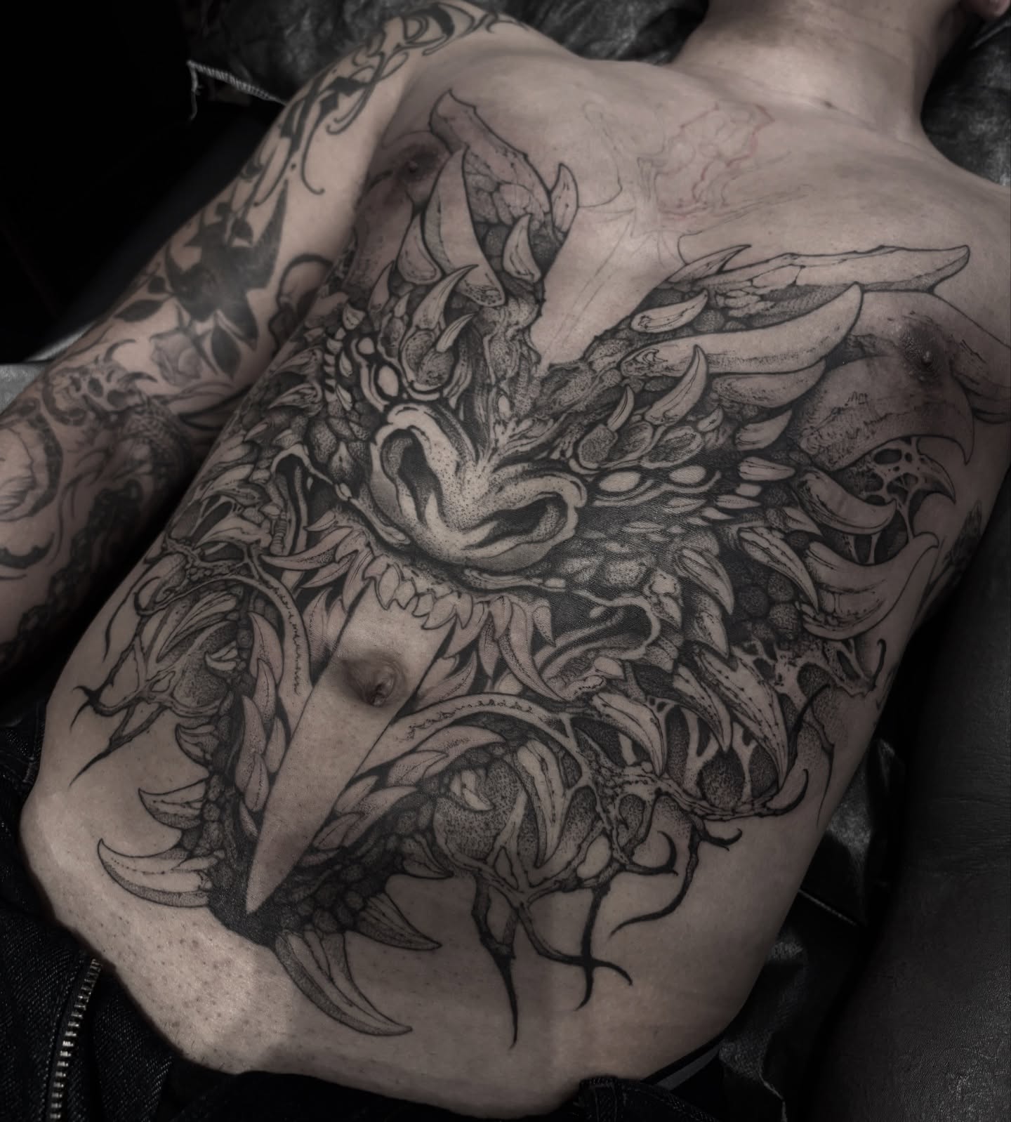 Dragon dotwork tattoo on the back by Becci Chelicerata
