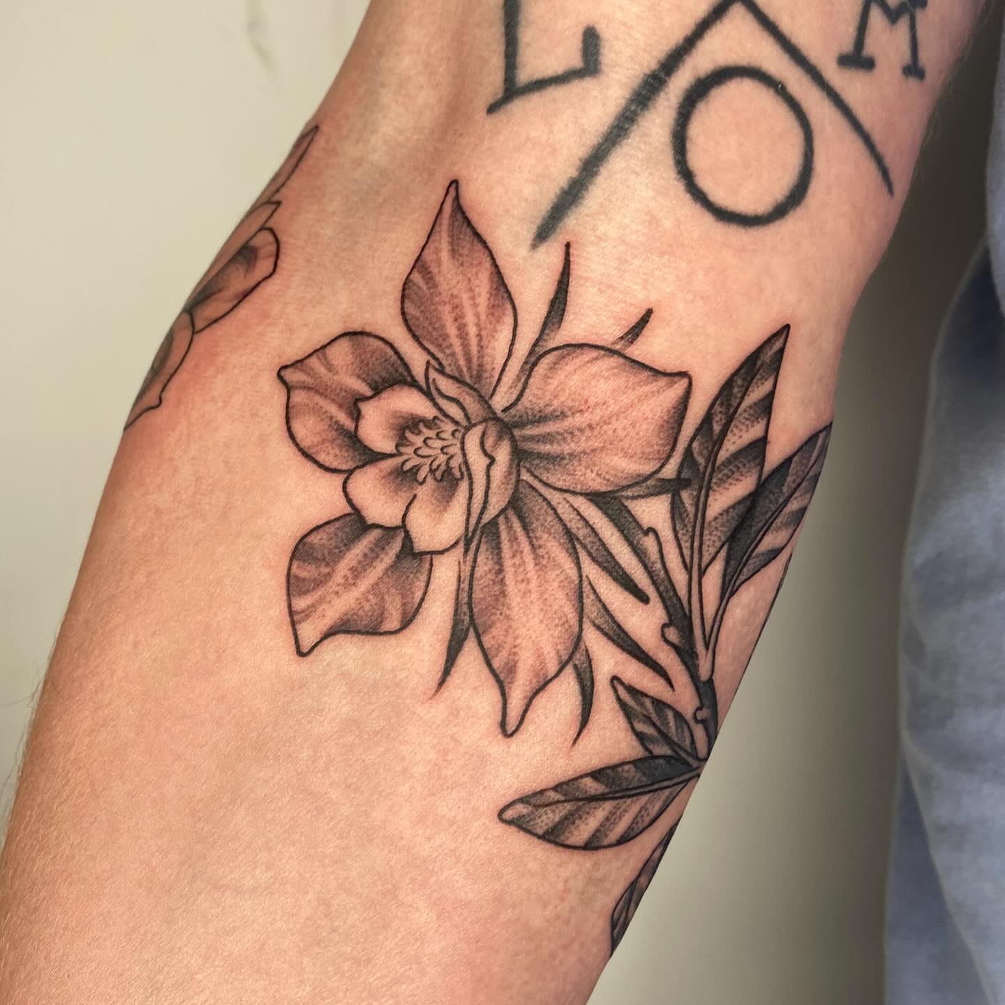Flower black and grey tattoo on the forearm by Vivian HavaTattoo, Richmond, Virginia