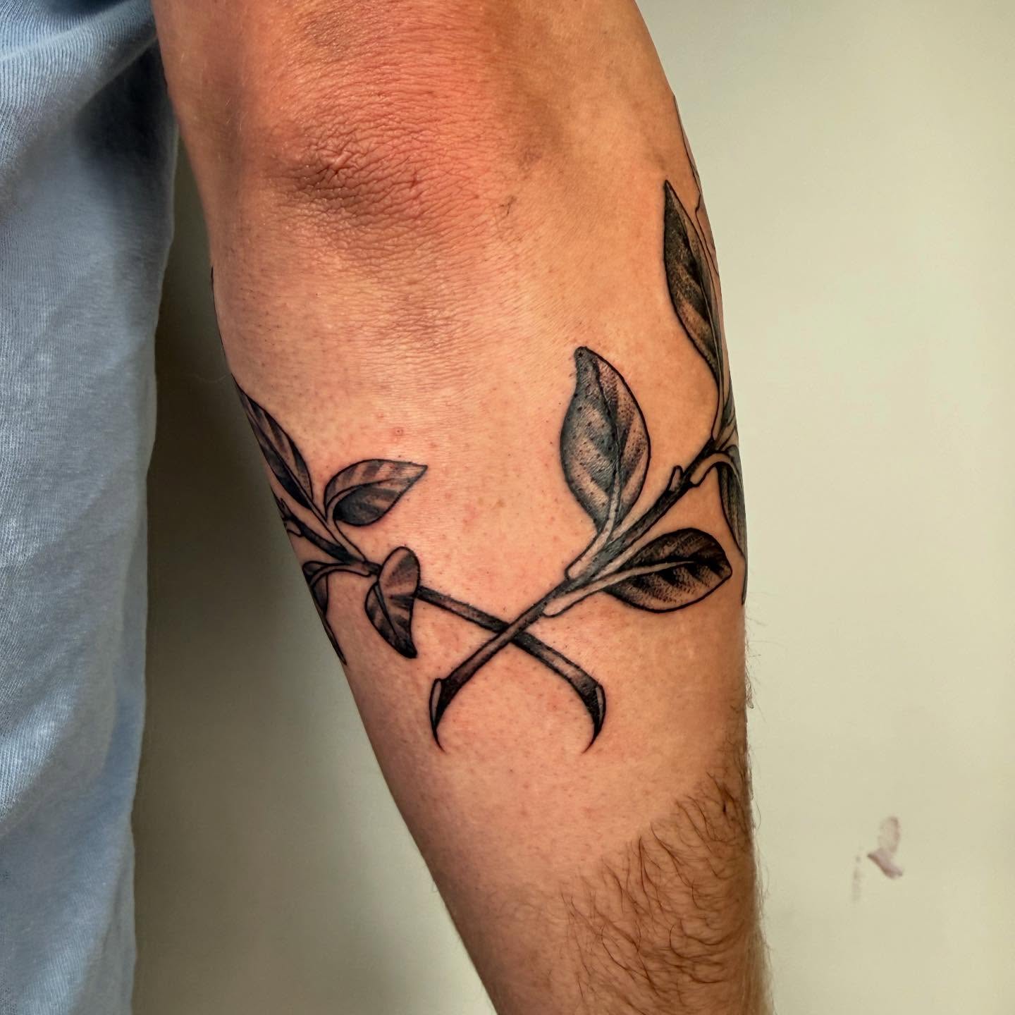 Branch with leaves black and grey tattoo on the forearm by Vivian HavaTattoo, Richmond, Virginia