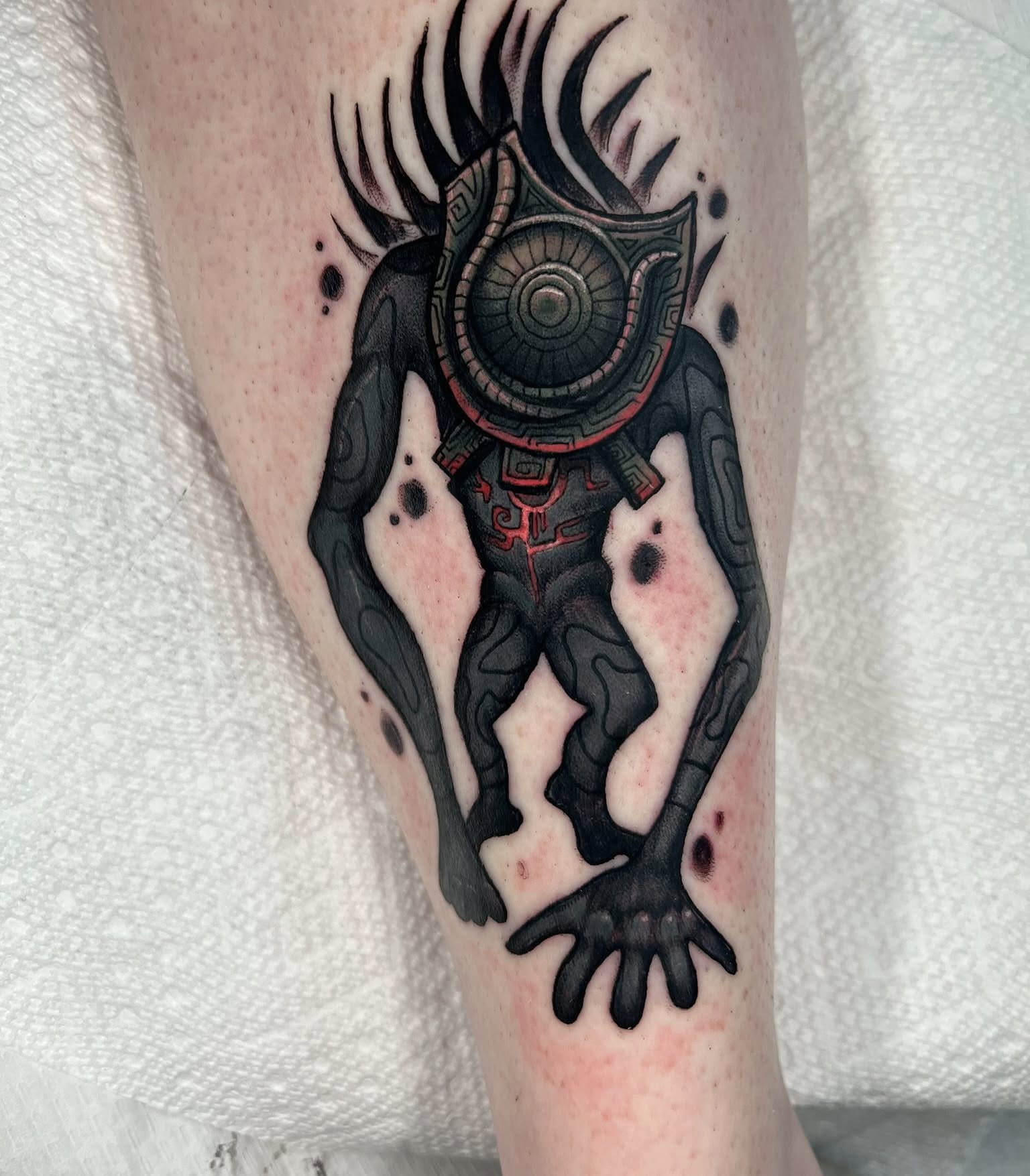 Mask creature geometric tattoo on the forearm by Brandon Durbin