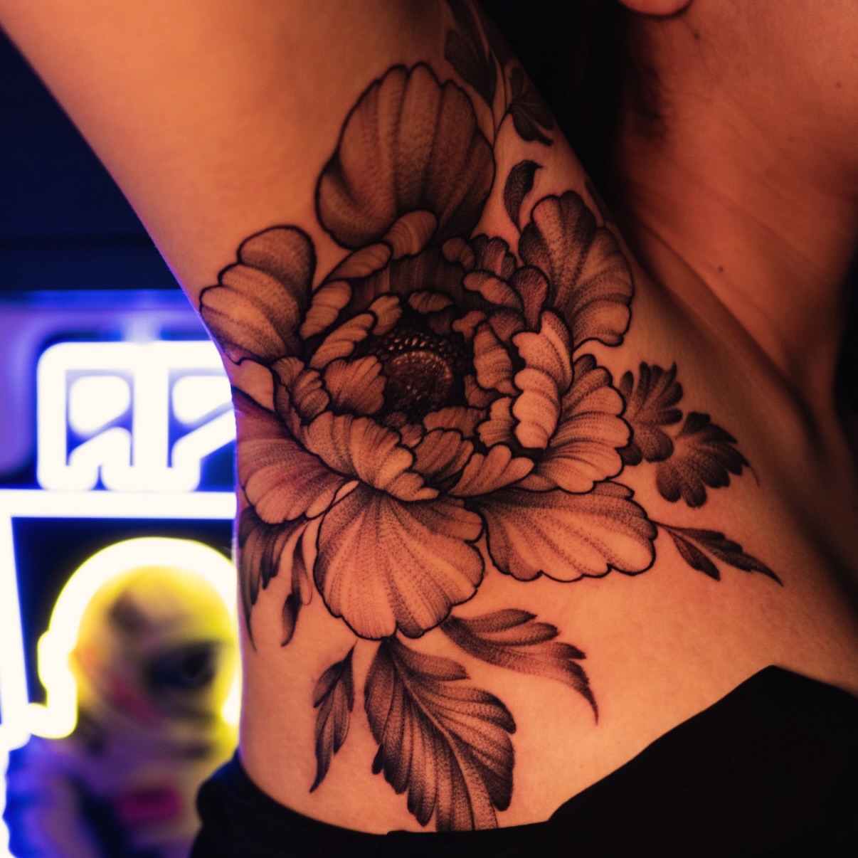 Peony flower black and grey tattoo on the ribs by Apolo