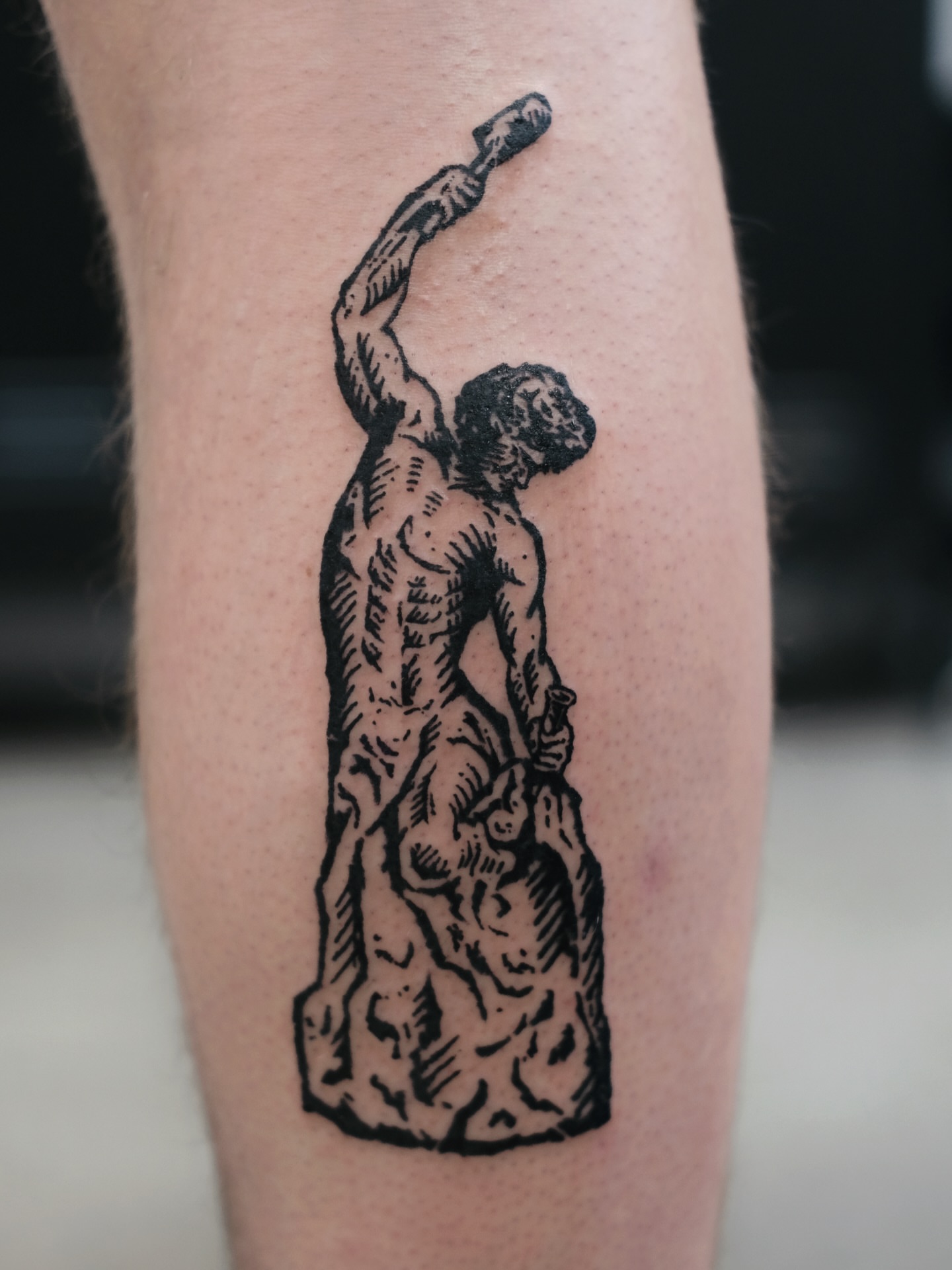 Statue of atlas black and grey tattoo on the forearm by ꜰʟᴏʀᴀ ᴡᴏᴏᴅᴄᴜᴛ ᴛᴀᴛᴛᴏᴏ