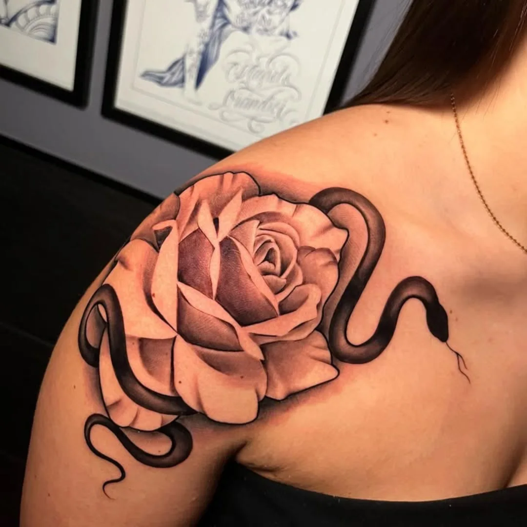 Rose and snake realism tattoo on the shoulder by ink.alchemist
