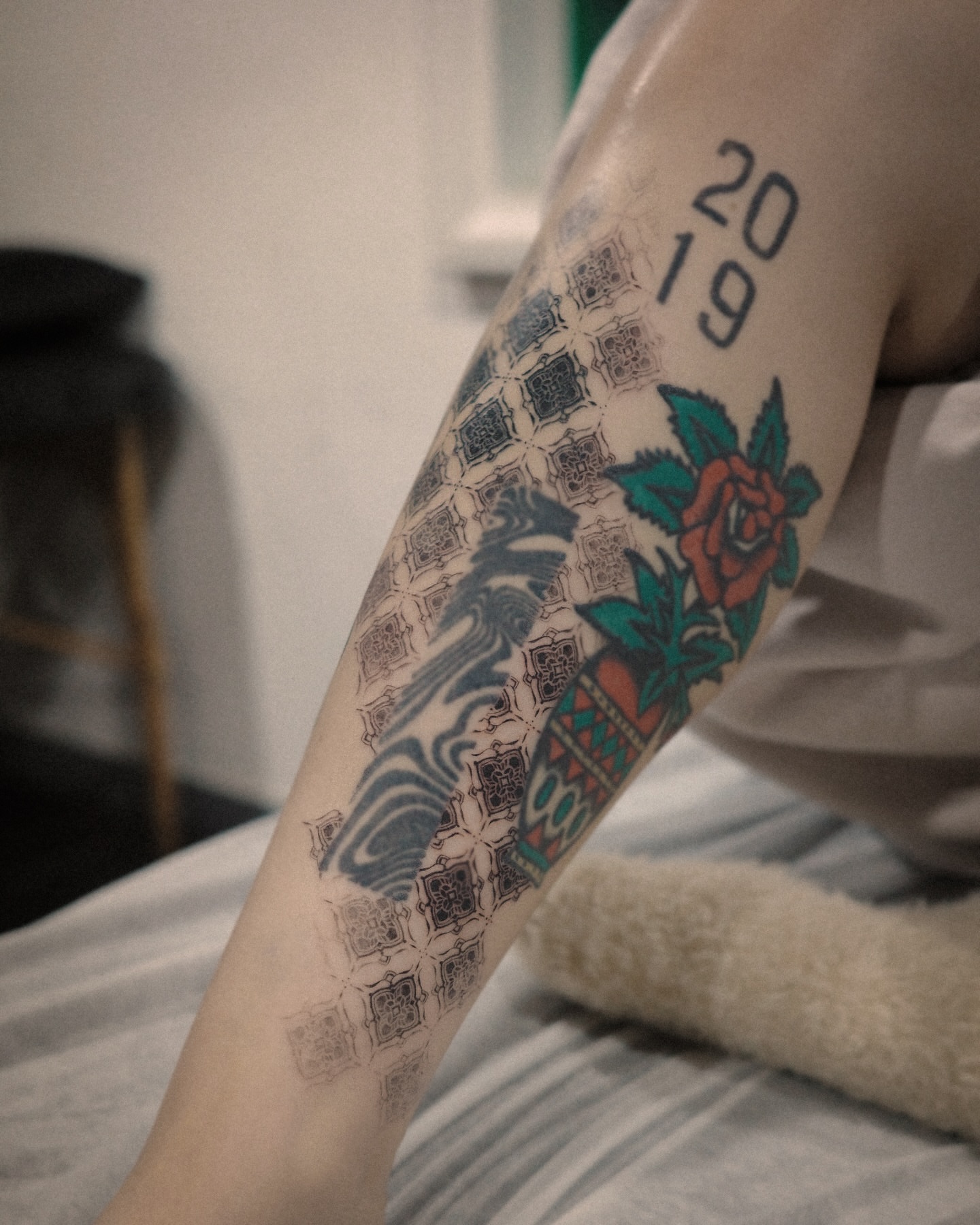 Geometric pattern with rose American traditional tattoo on the forearm by Easy