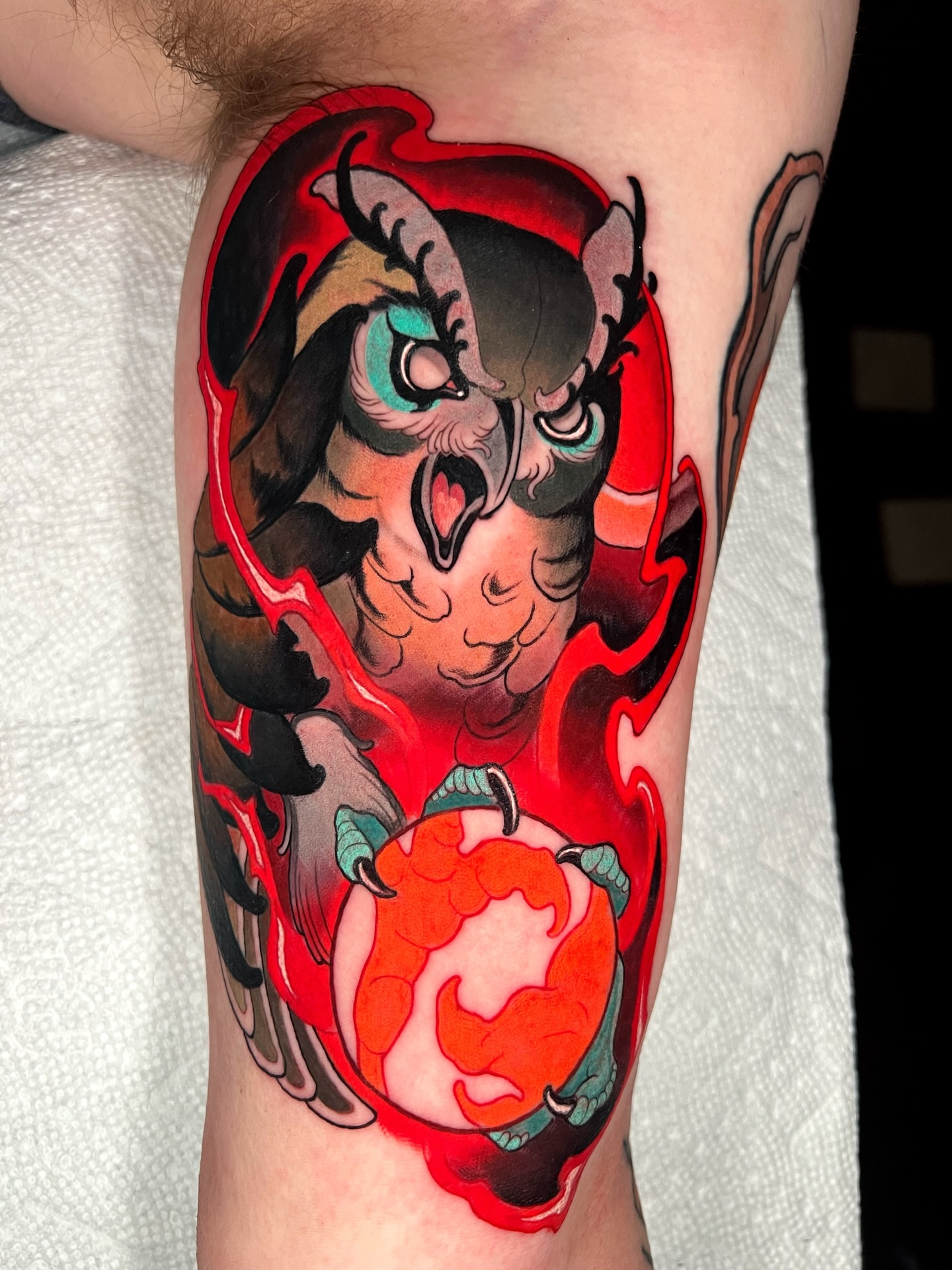 Owl and flame American traditional tattoo on the forearm by Skyler Miller